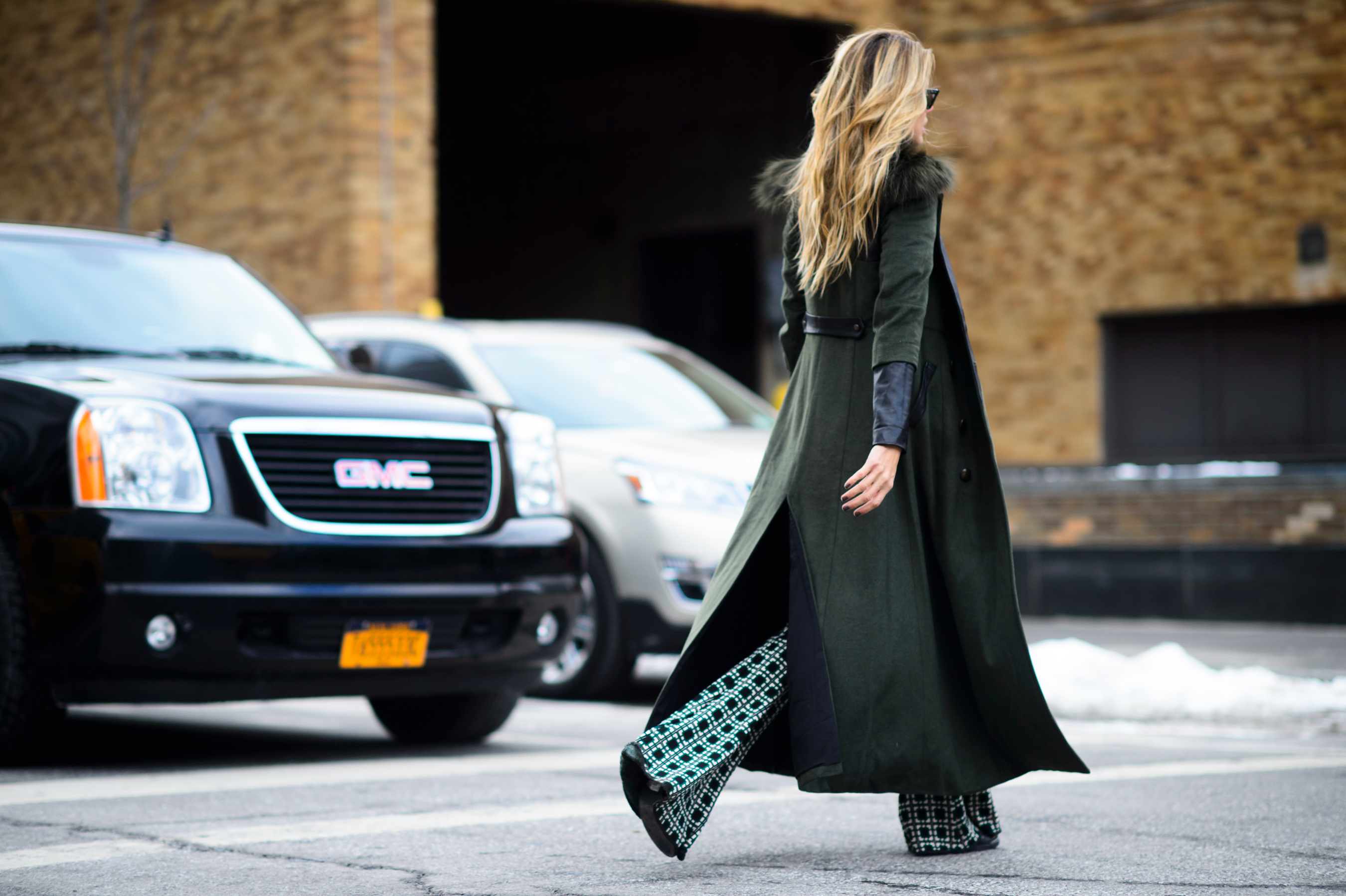 Woman wearing long green coat