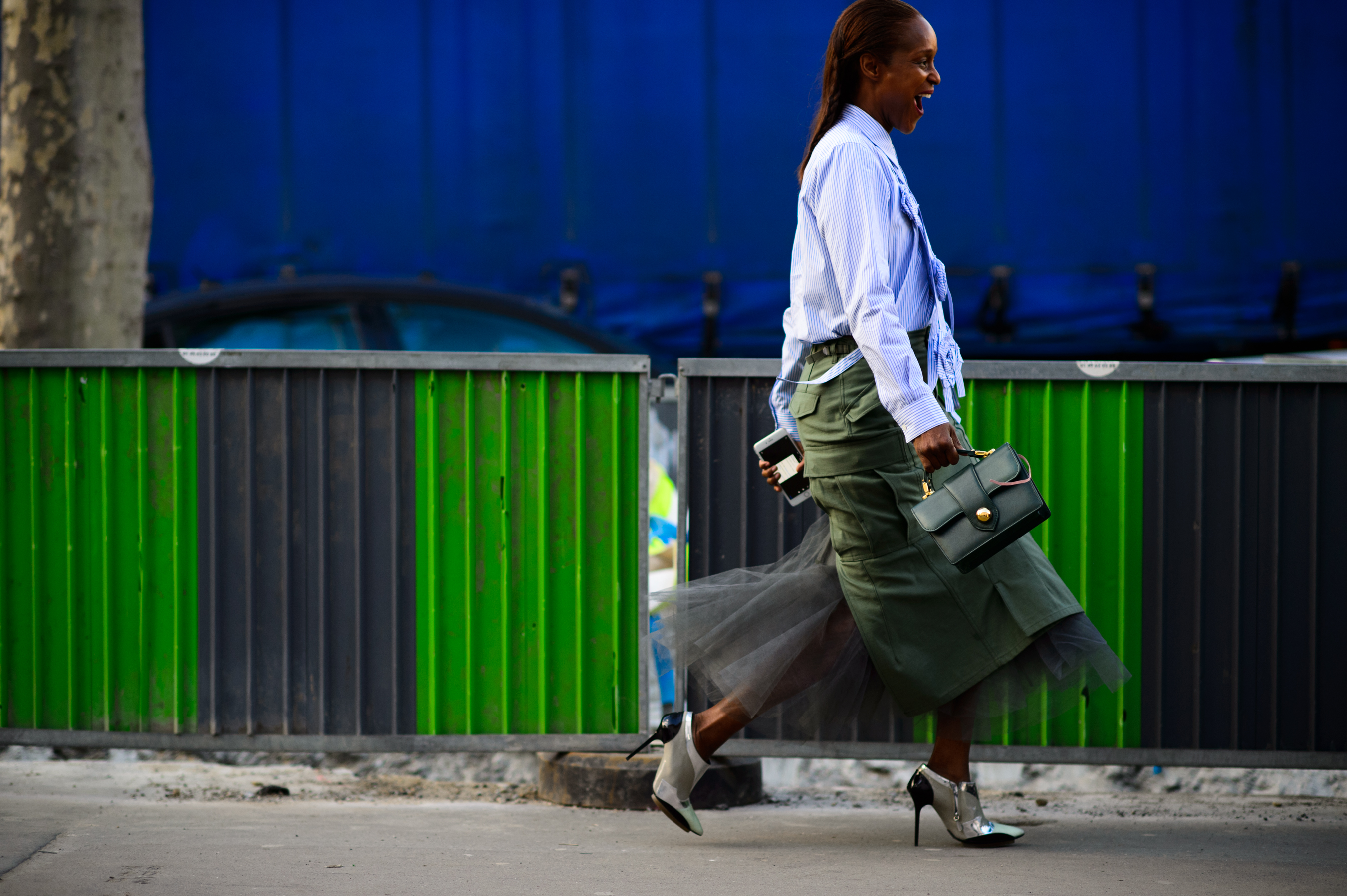 Woman wearing green skirt before the show