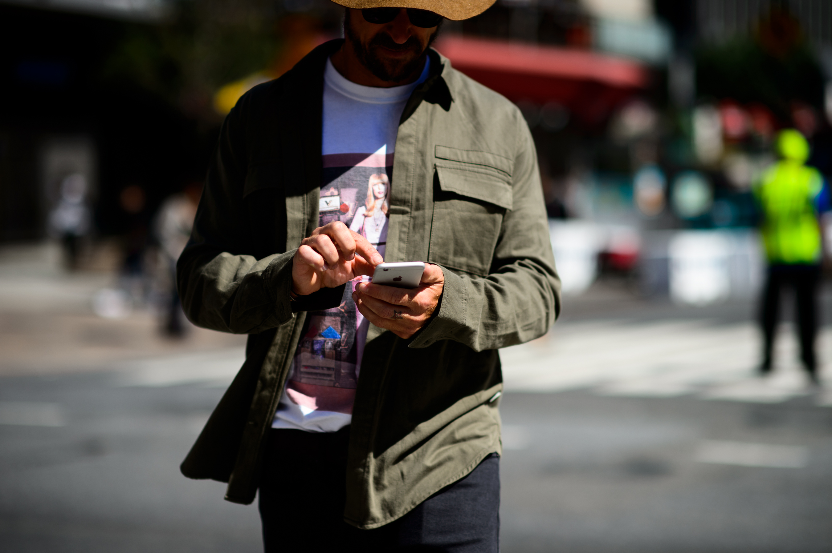 Man wearing khaki jacket and hat