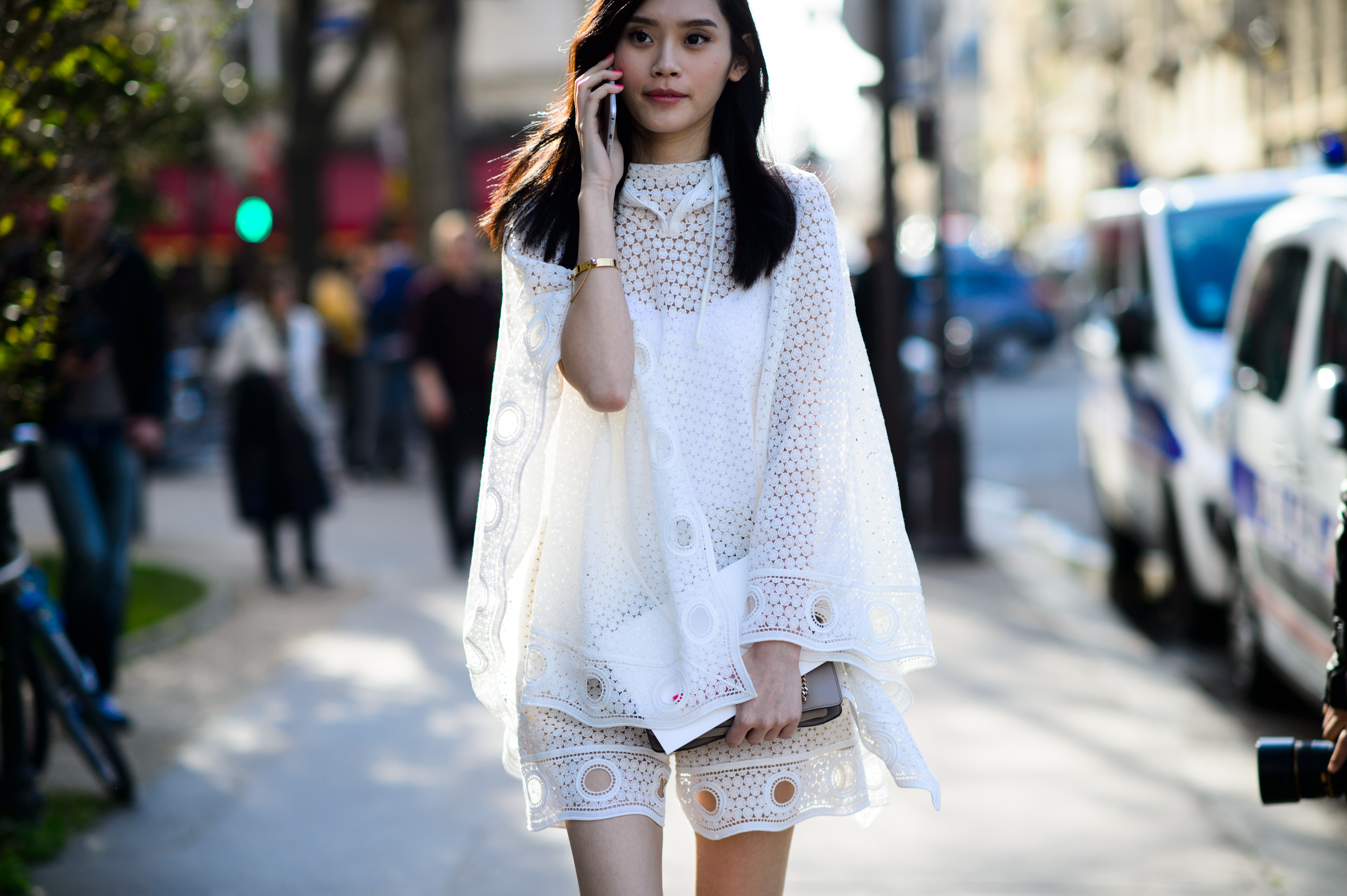Model wearing white lace outfit after the show