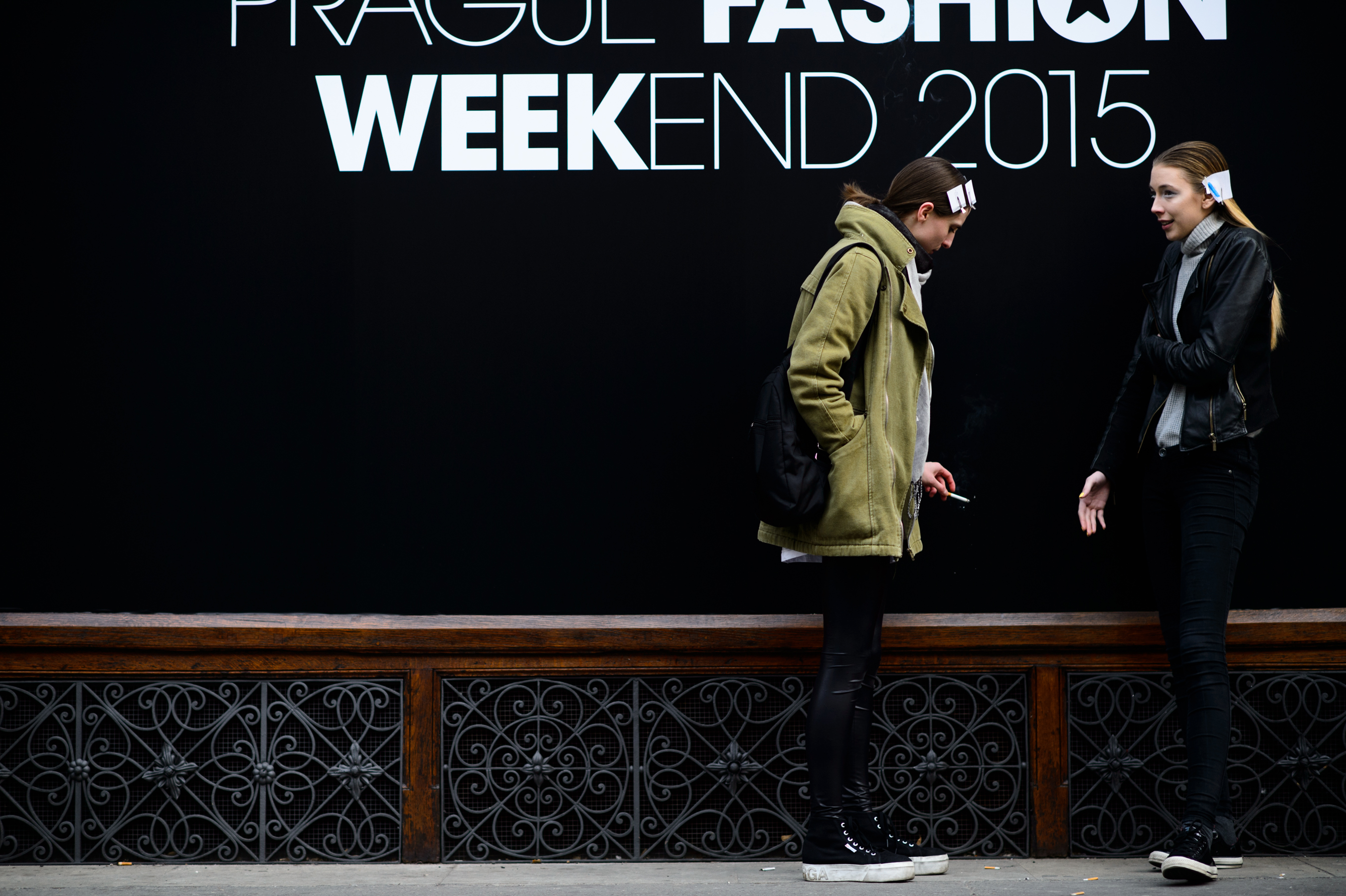 Two models with clipped hair before the show