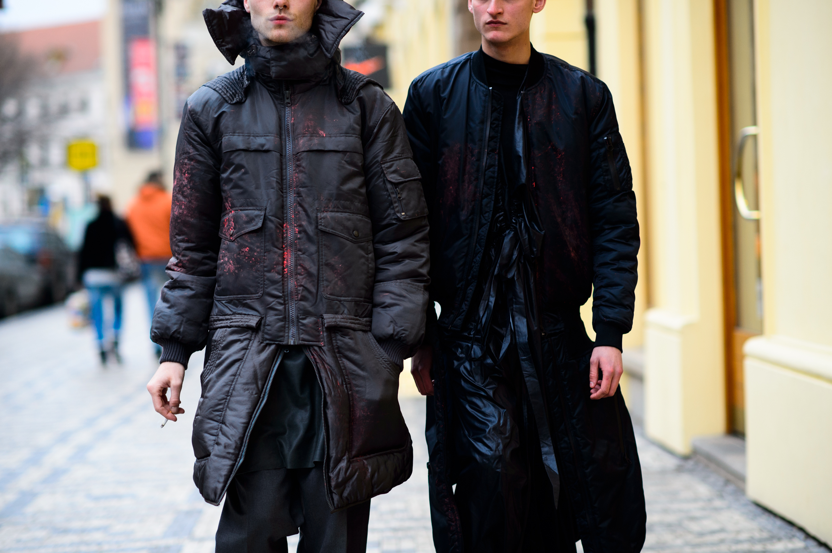 Two men wearing bomber jackets