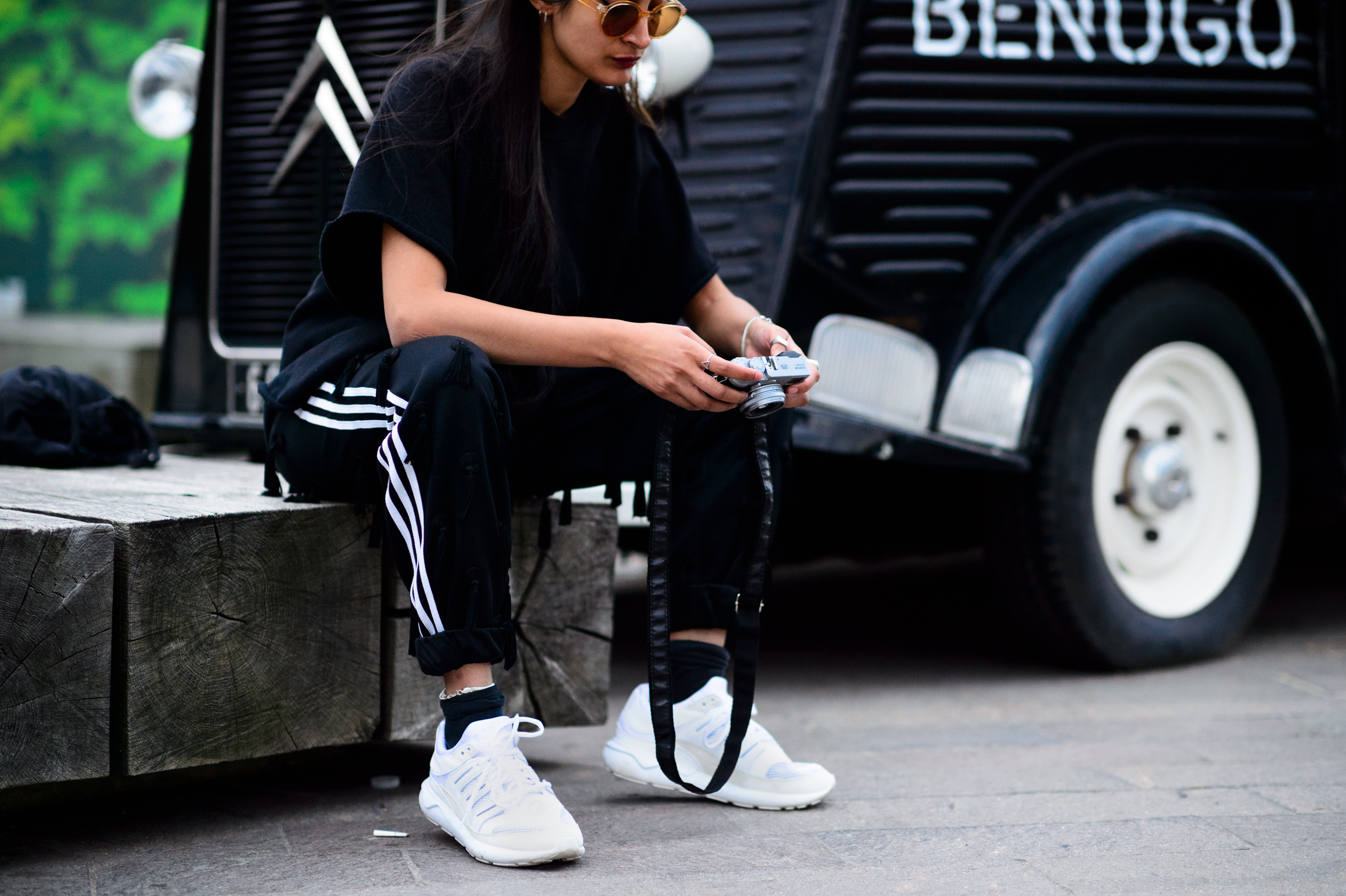 Photographer sitting on the wooden bench