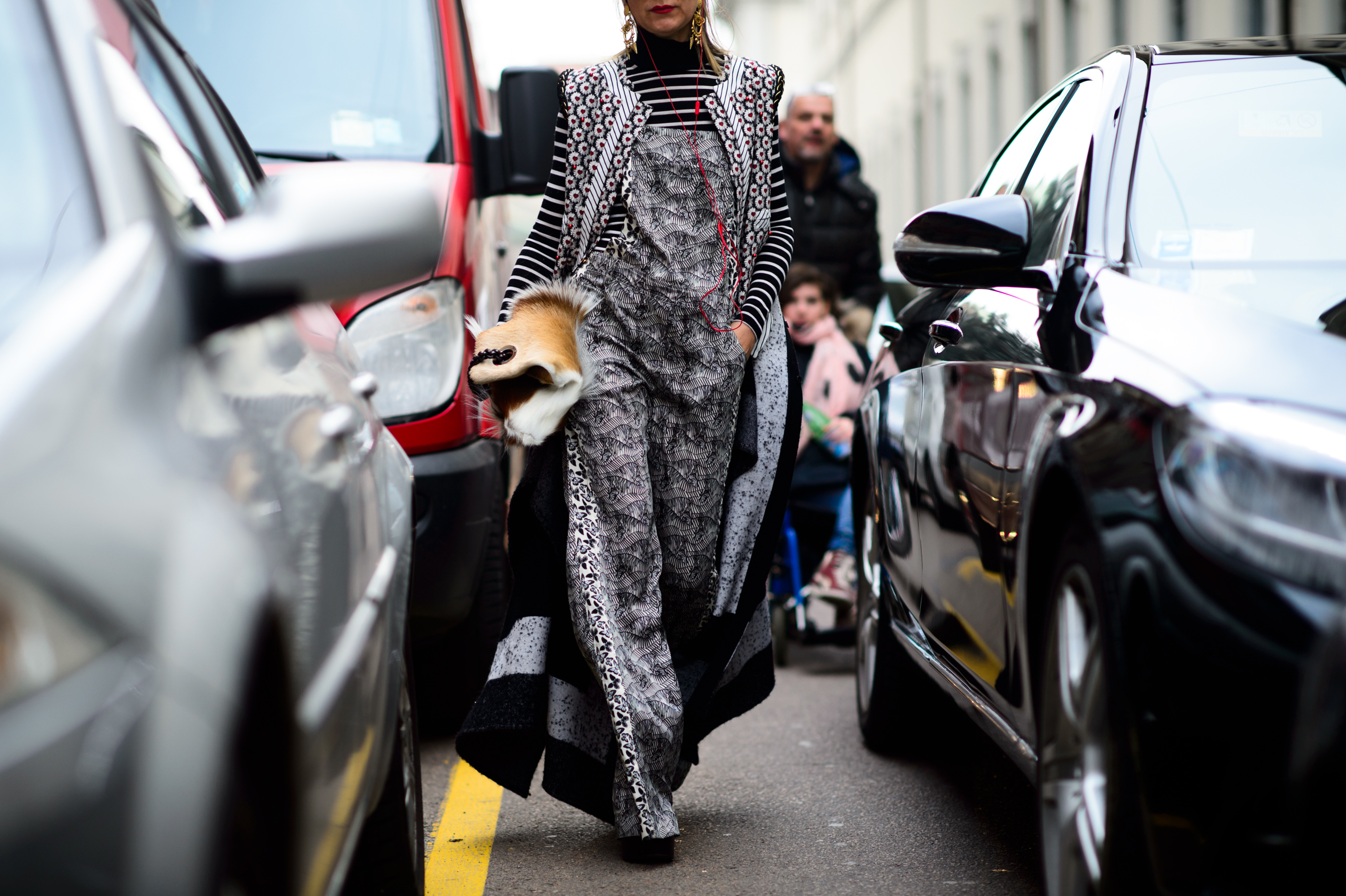 Woman carrying cow fur bag