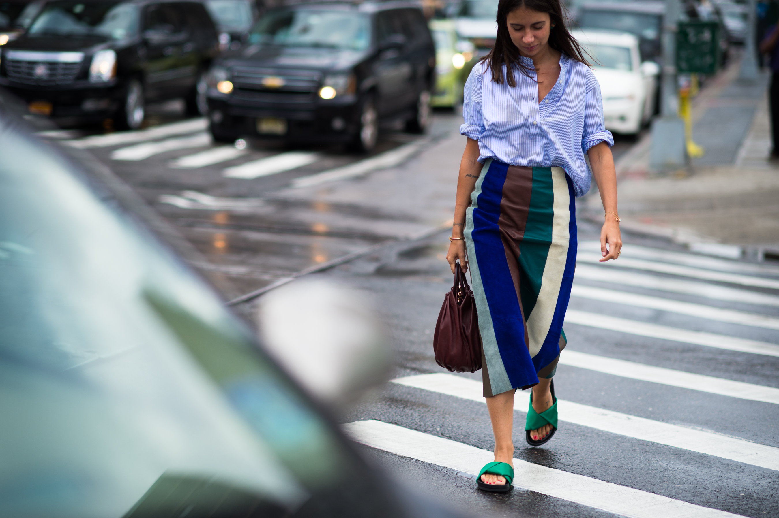 Russian buyer and stylist wearing green sliders and colorful skirt