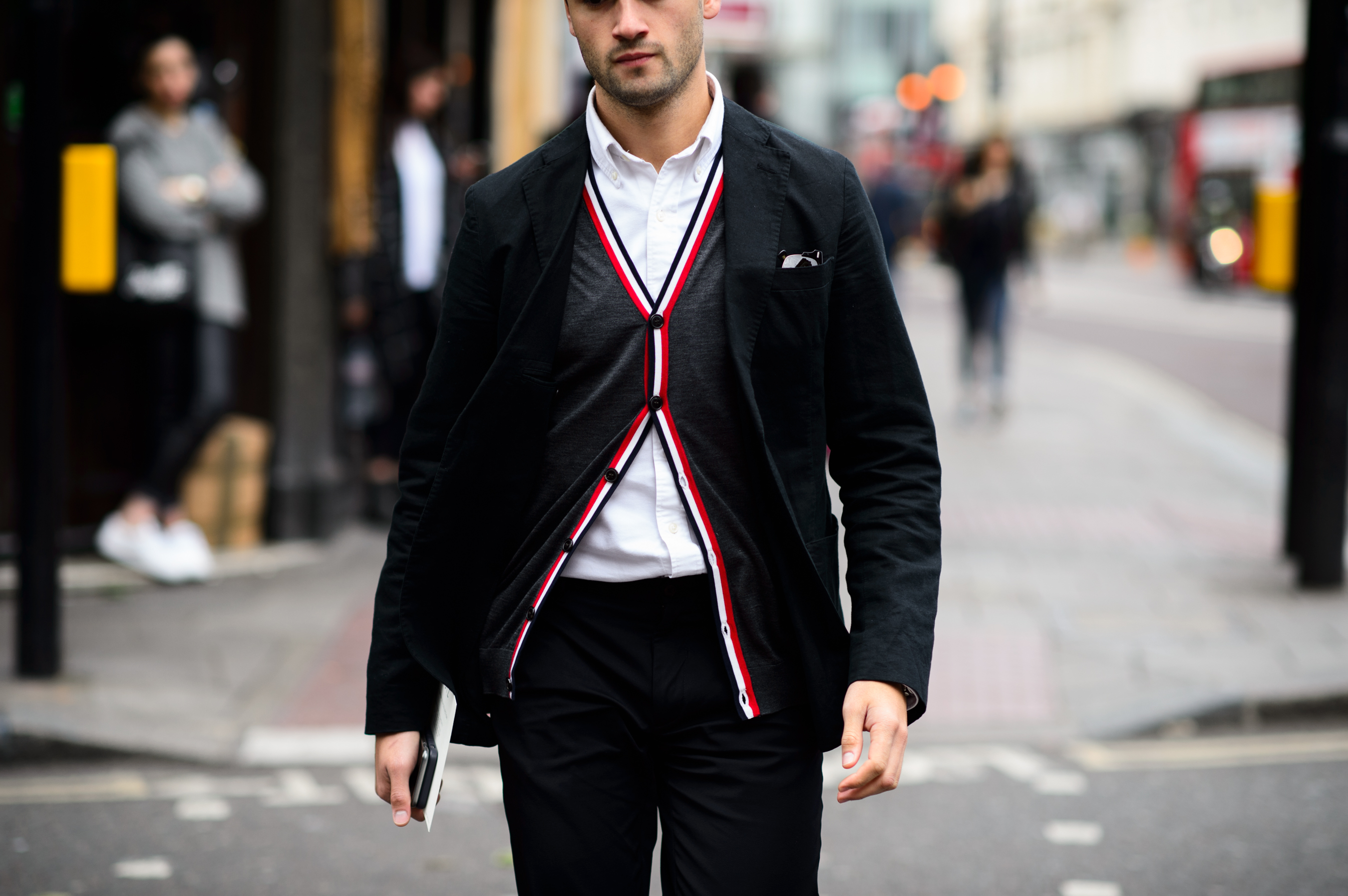 Man wearing grey suit with red inserts