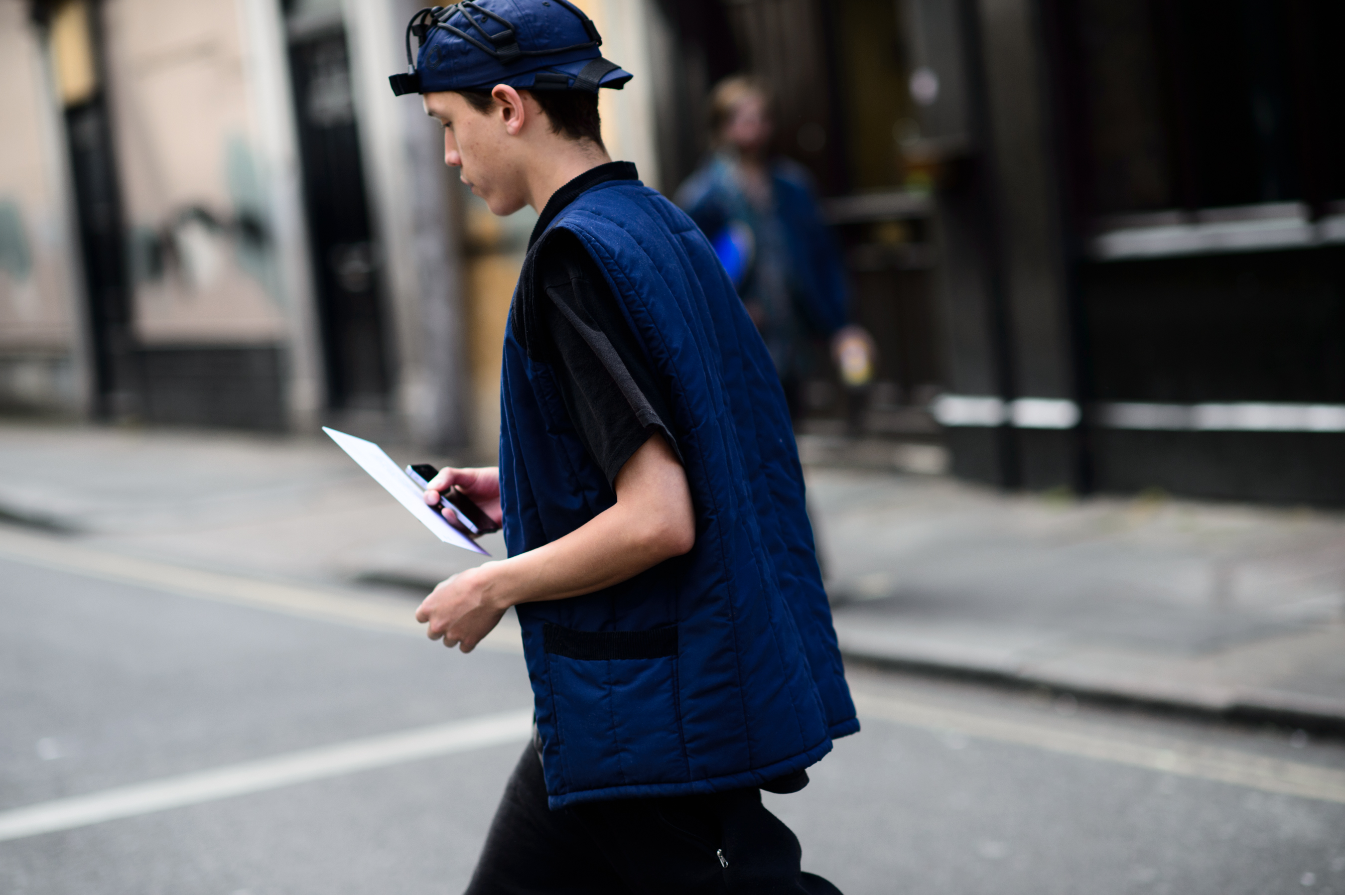Man wearing British designers crossing the street