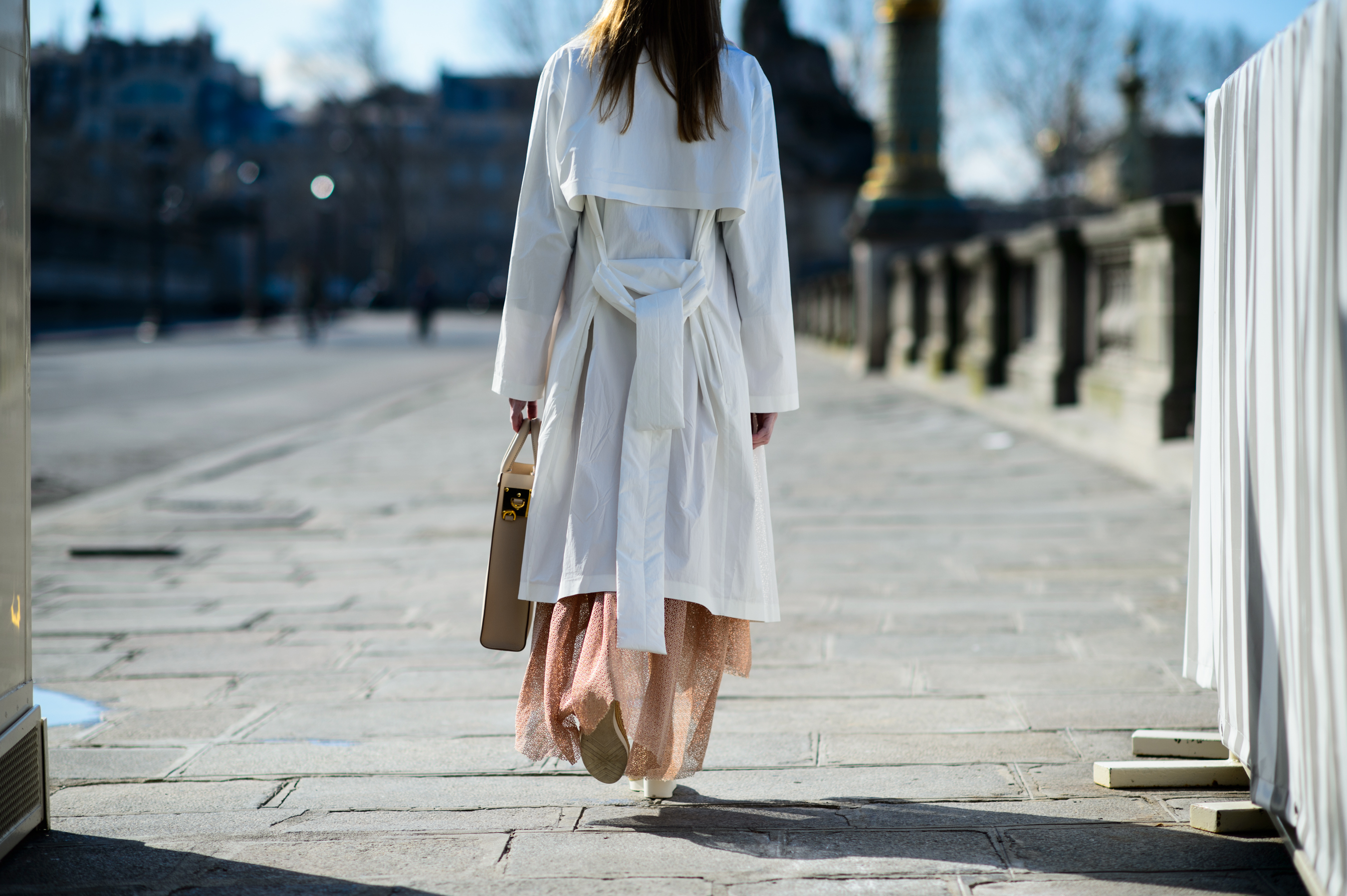 Woman wearing white coat