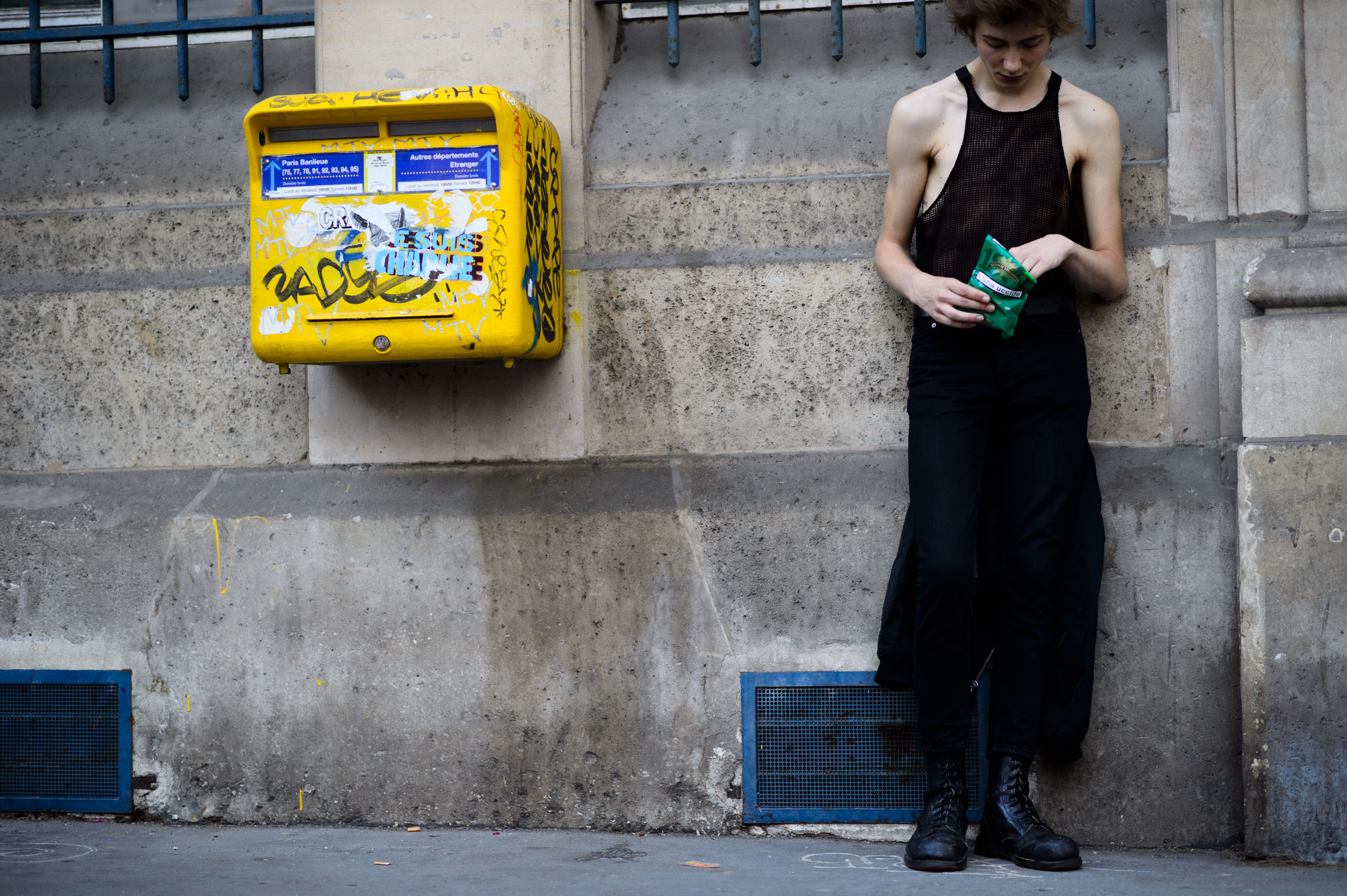 Male model in black tank top after the show