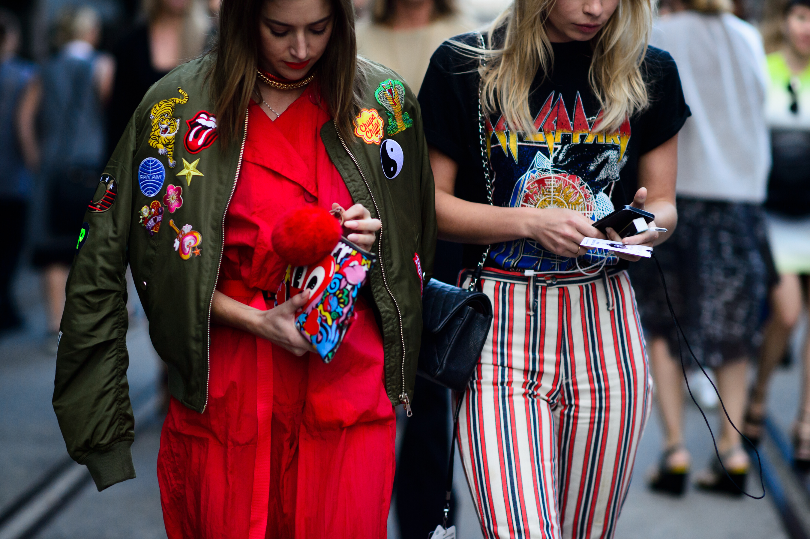 Two women wearing bright outfits