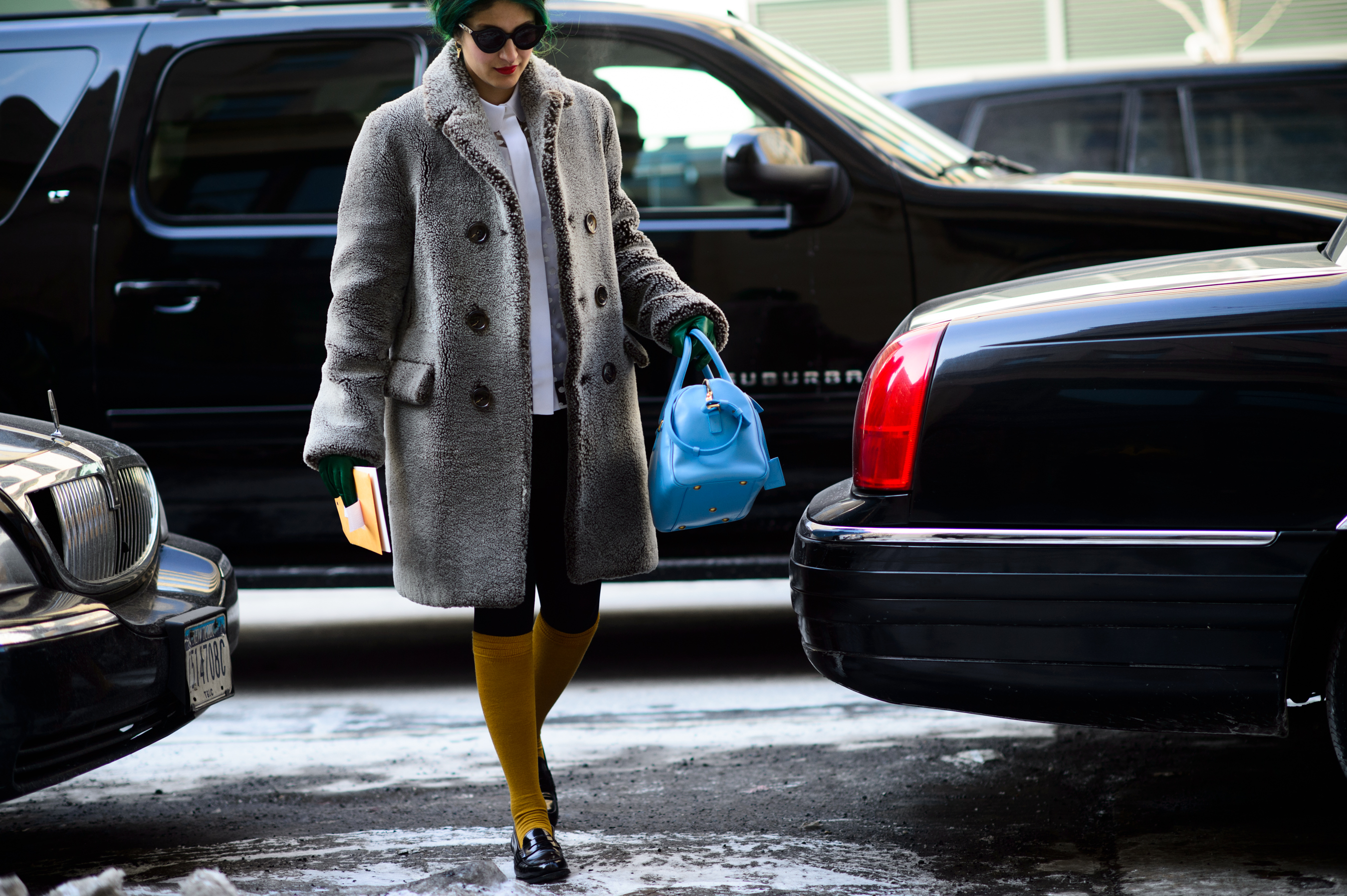 Editor with green hair wearing warm coat