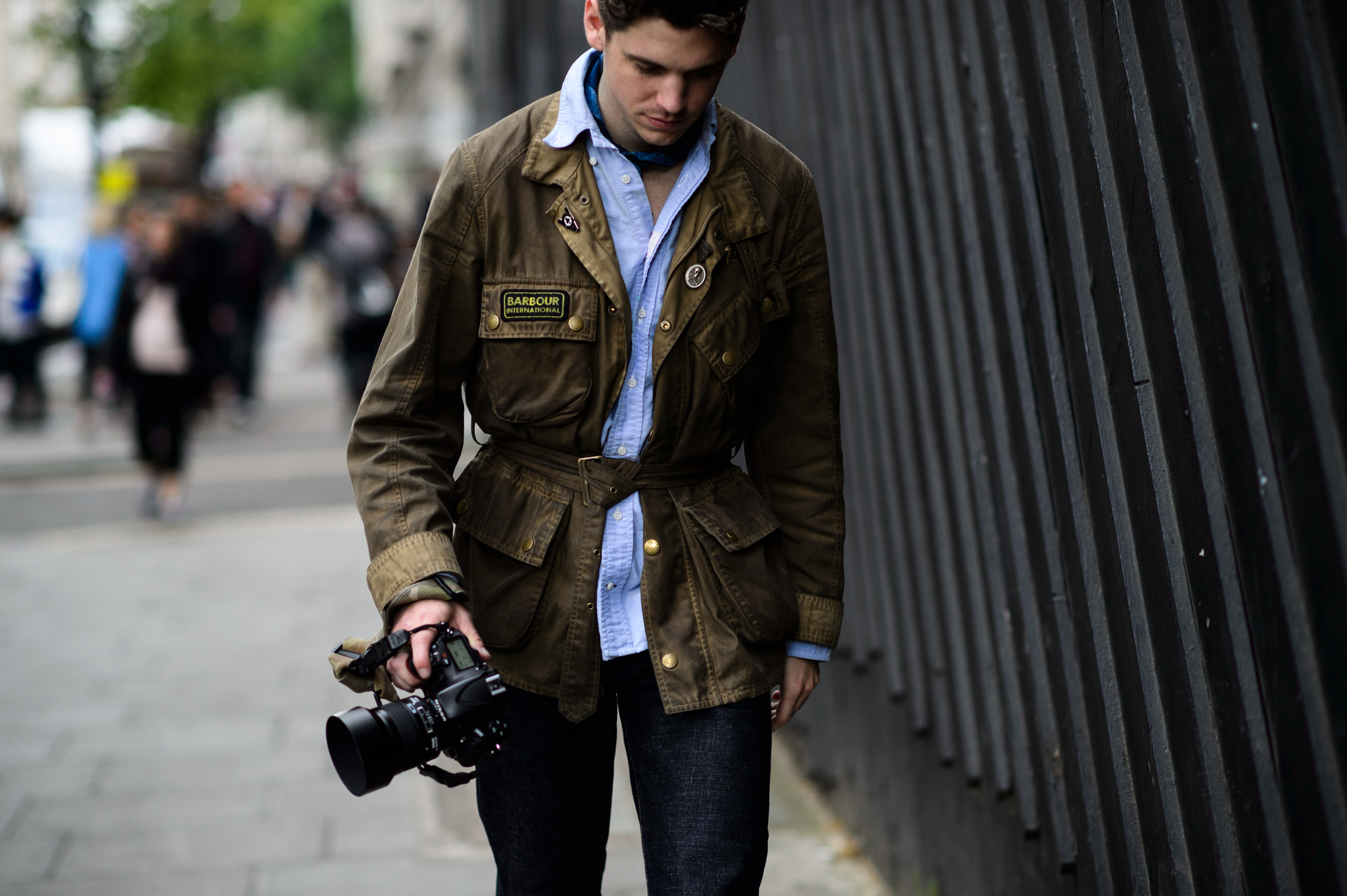 American street style photographer wearing military style jacket