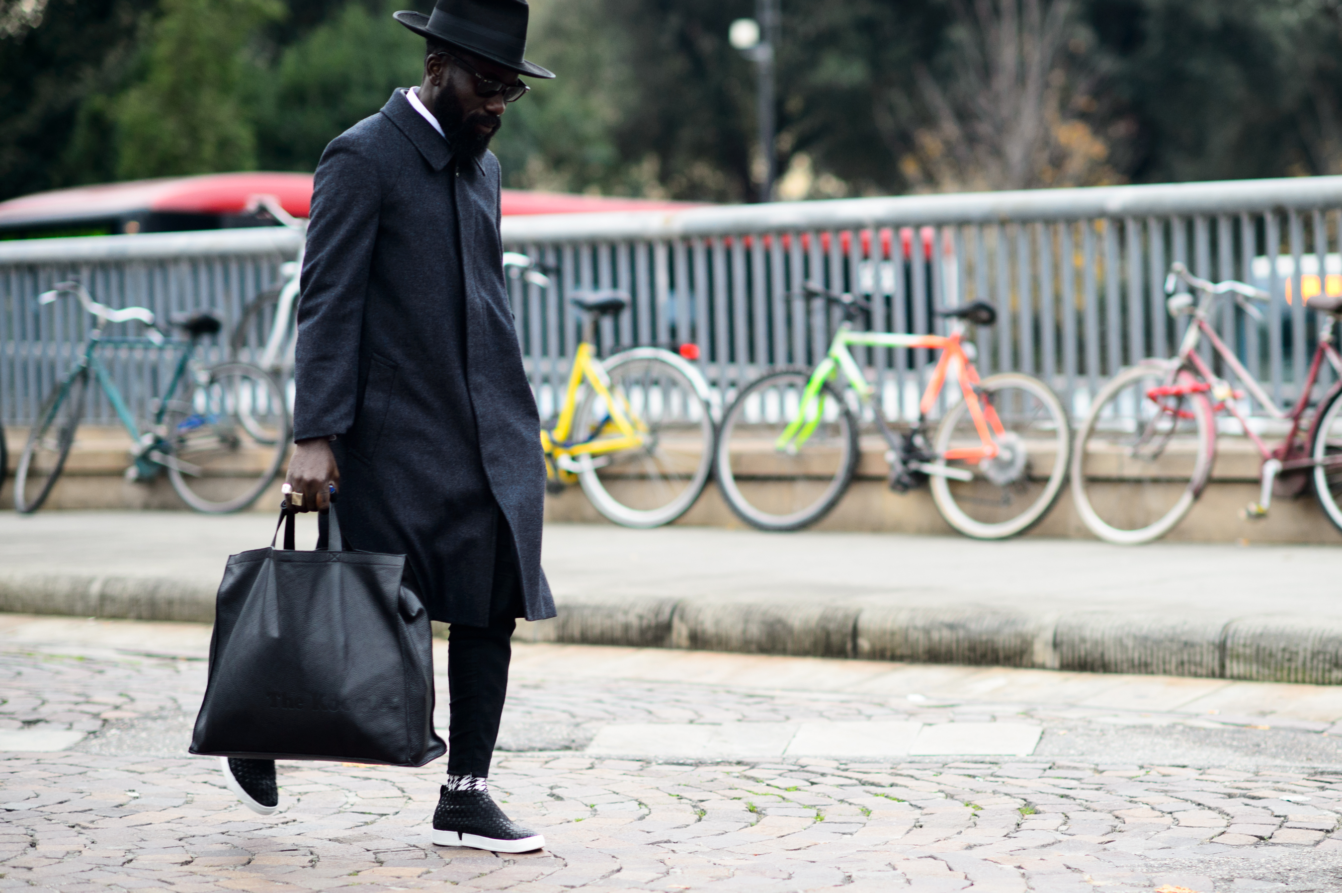 Art of you member wearing grey coat