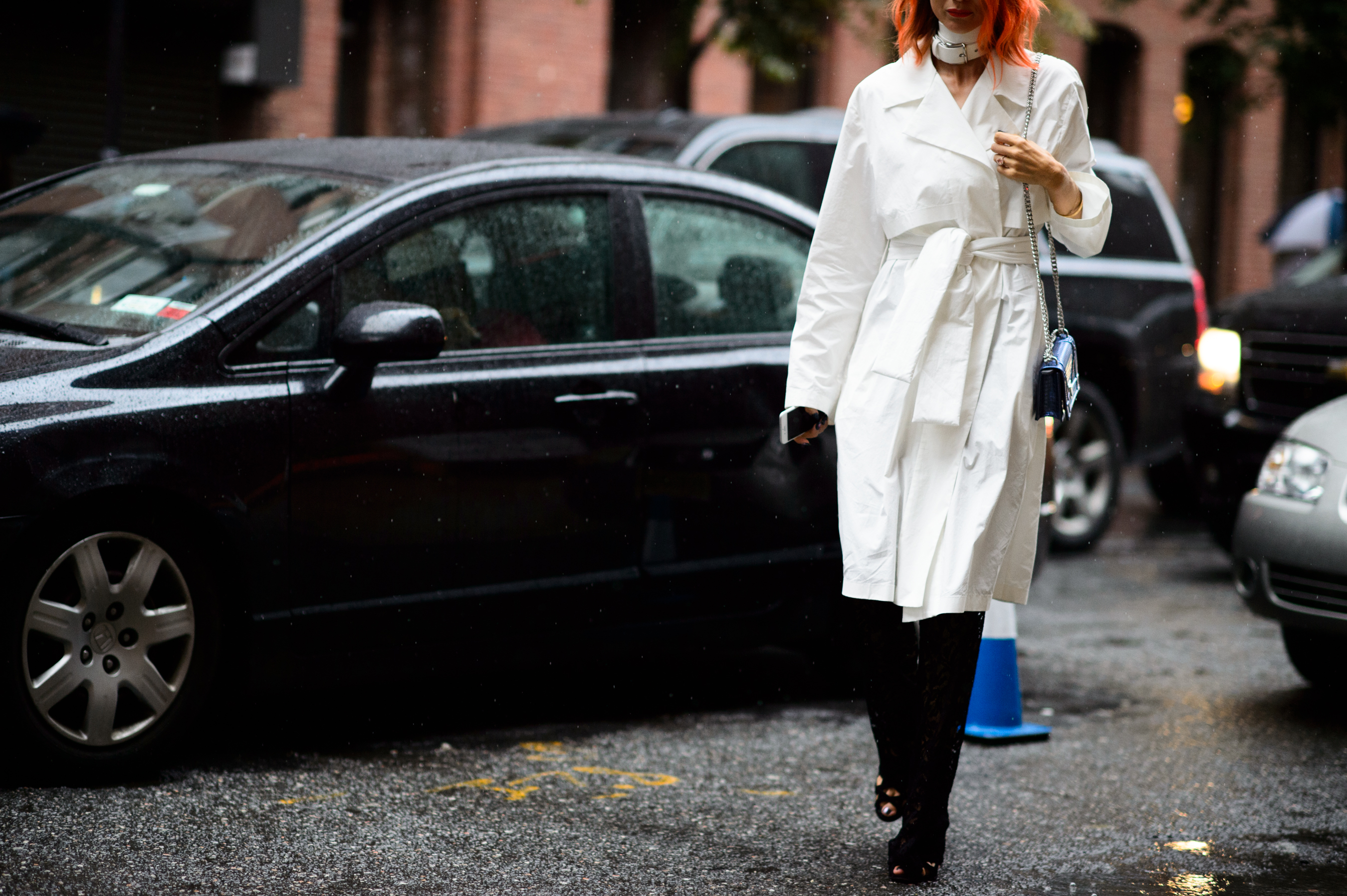 Blogger with pink hair wearing white coat