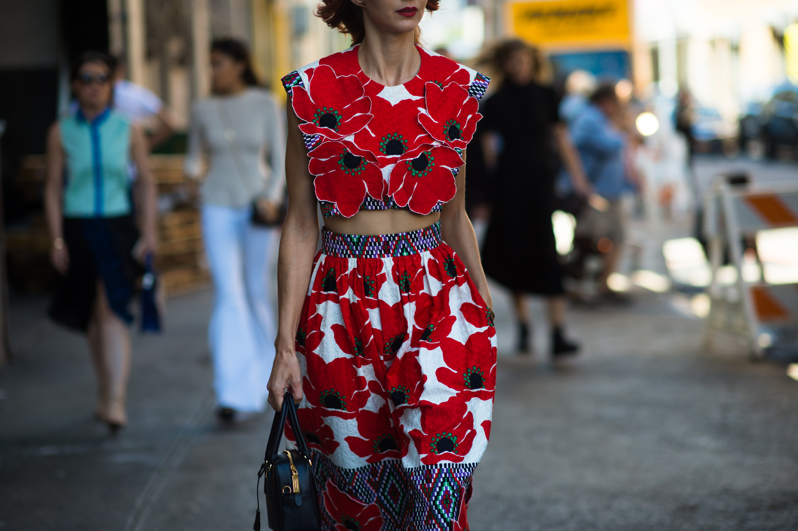 Woman wearing poppy flower dress