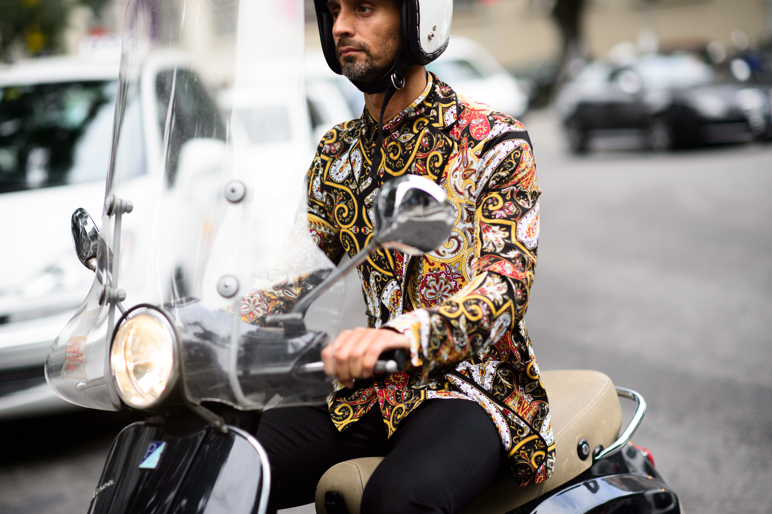 Italian journalist wearing bright shirt before the show