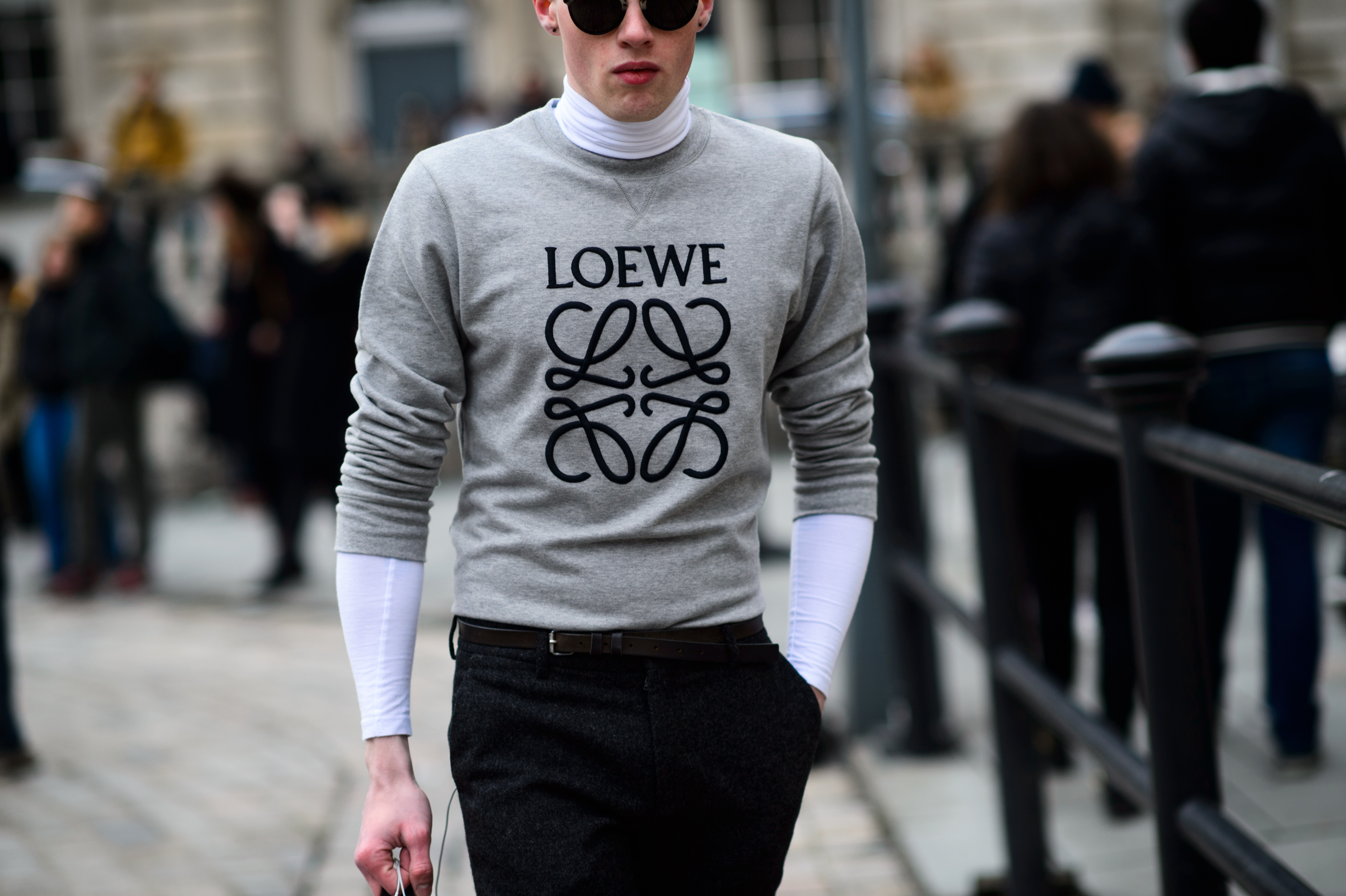 Man wearing sweatshirt by British designer