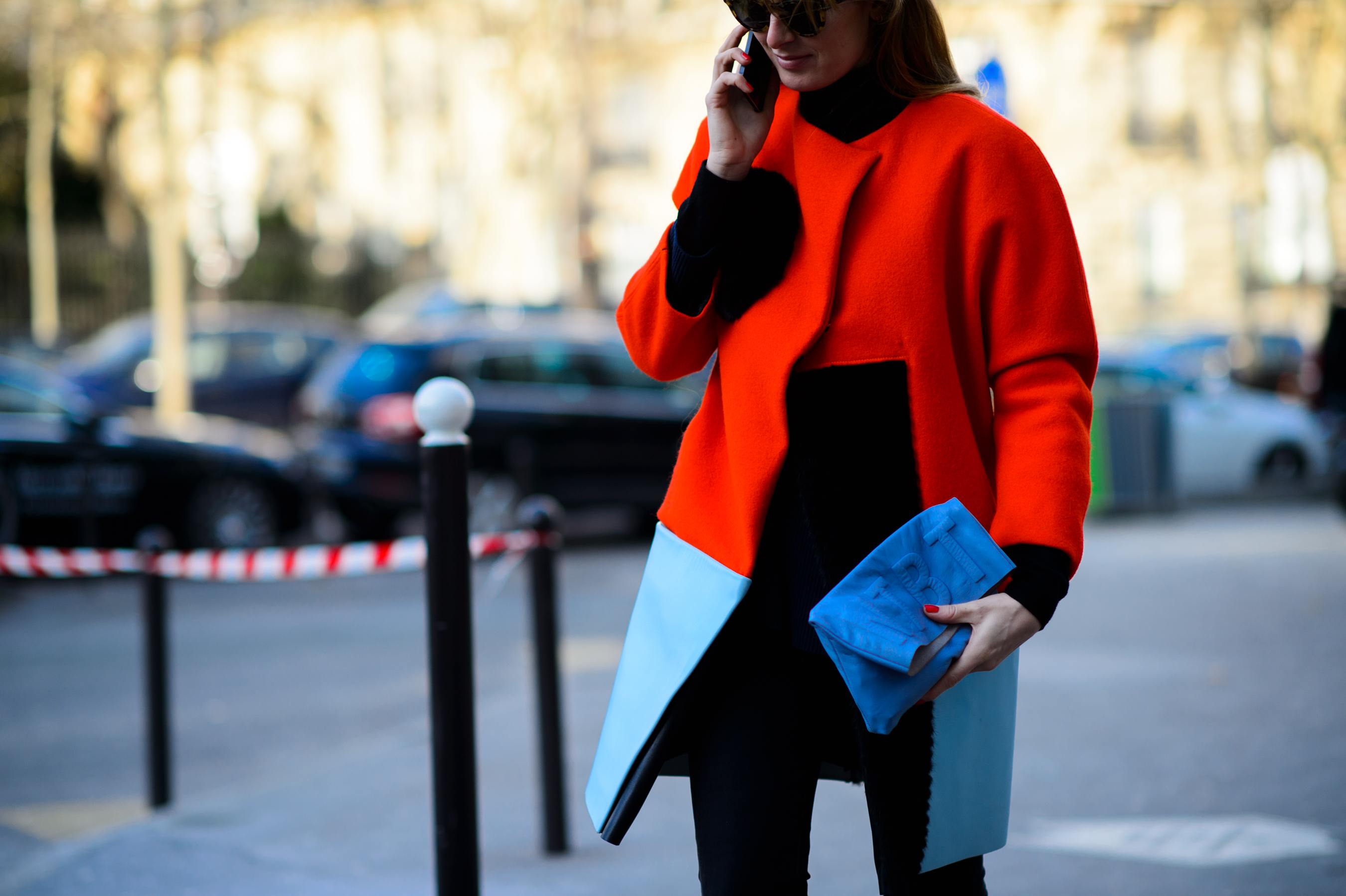 Woman wearing red and blue coat