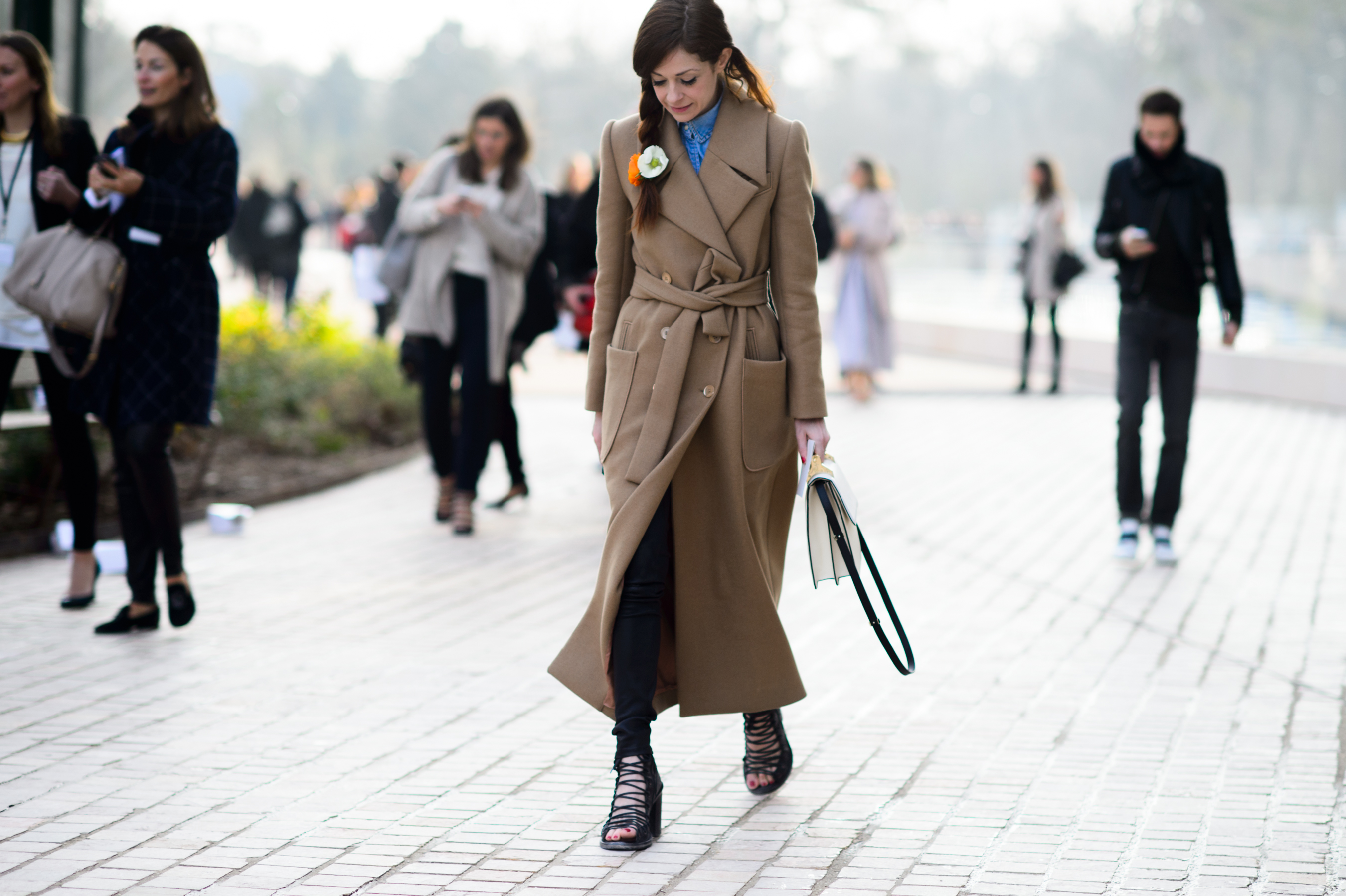 Woman wearing long beige coat