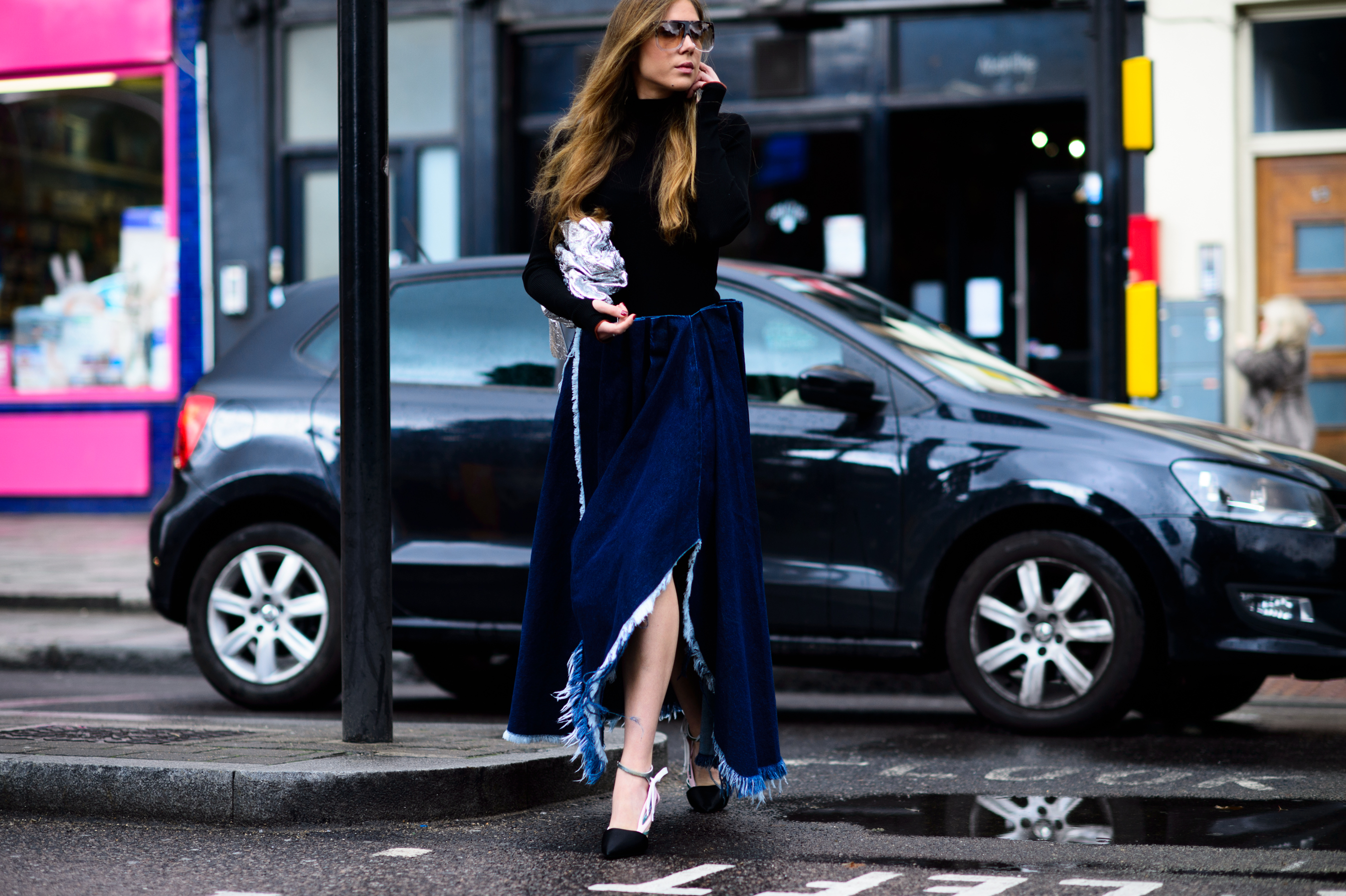 Woman wearing denim skirt before the show