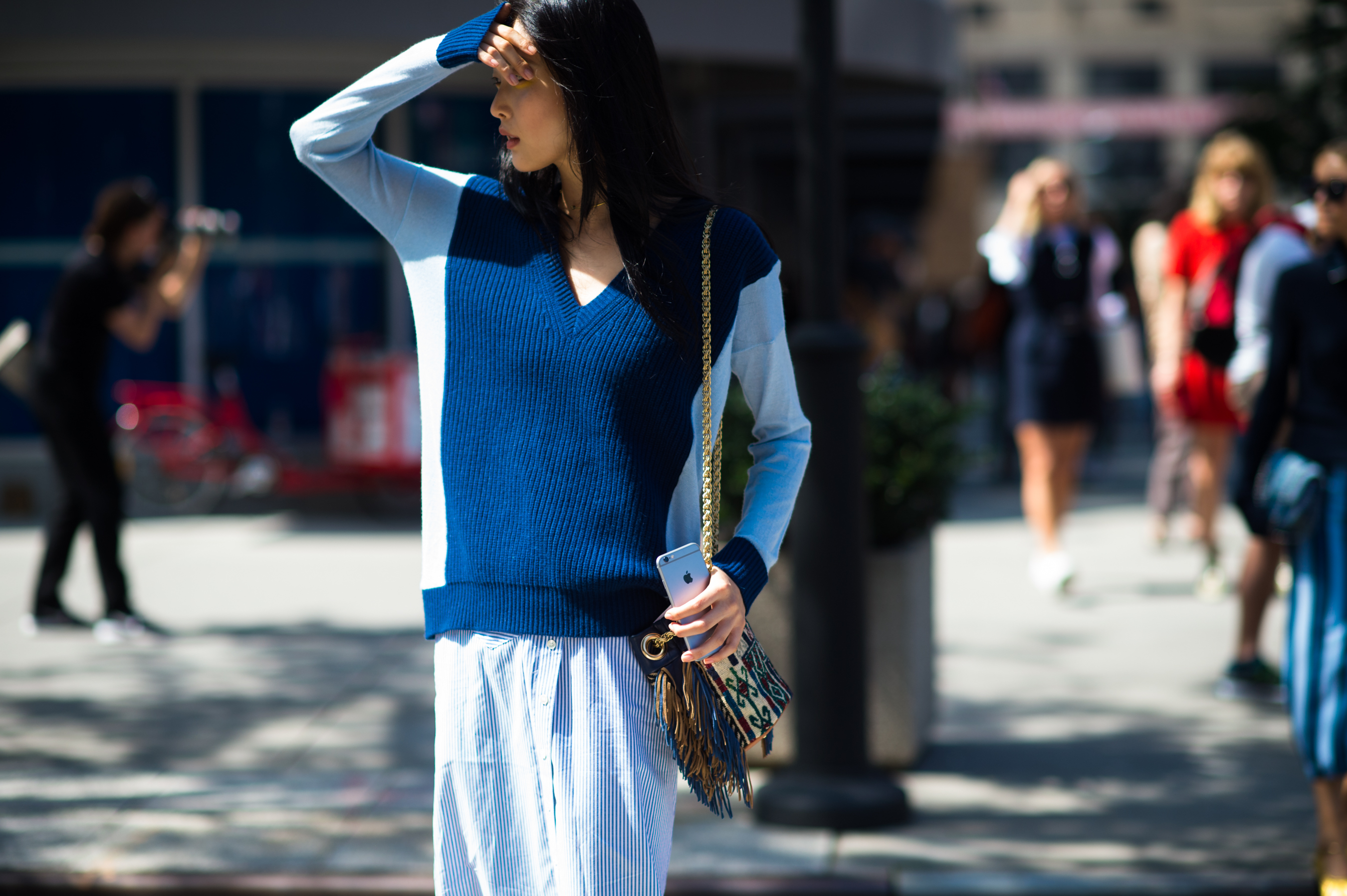Korean model covering her eyes from the sun
