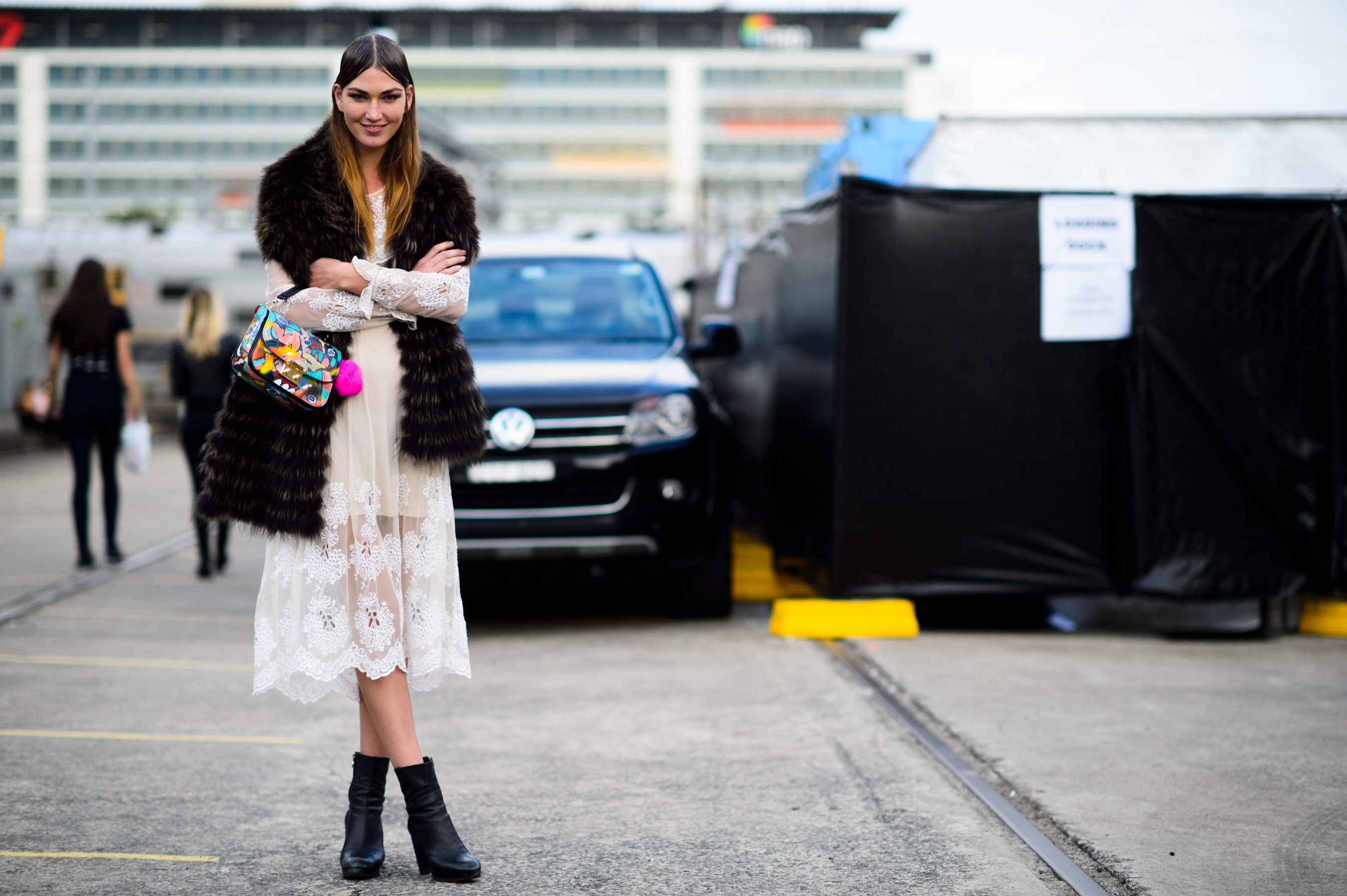 Model wearing fur vest after the show
