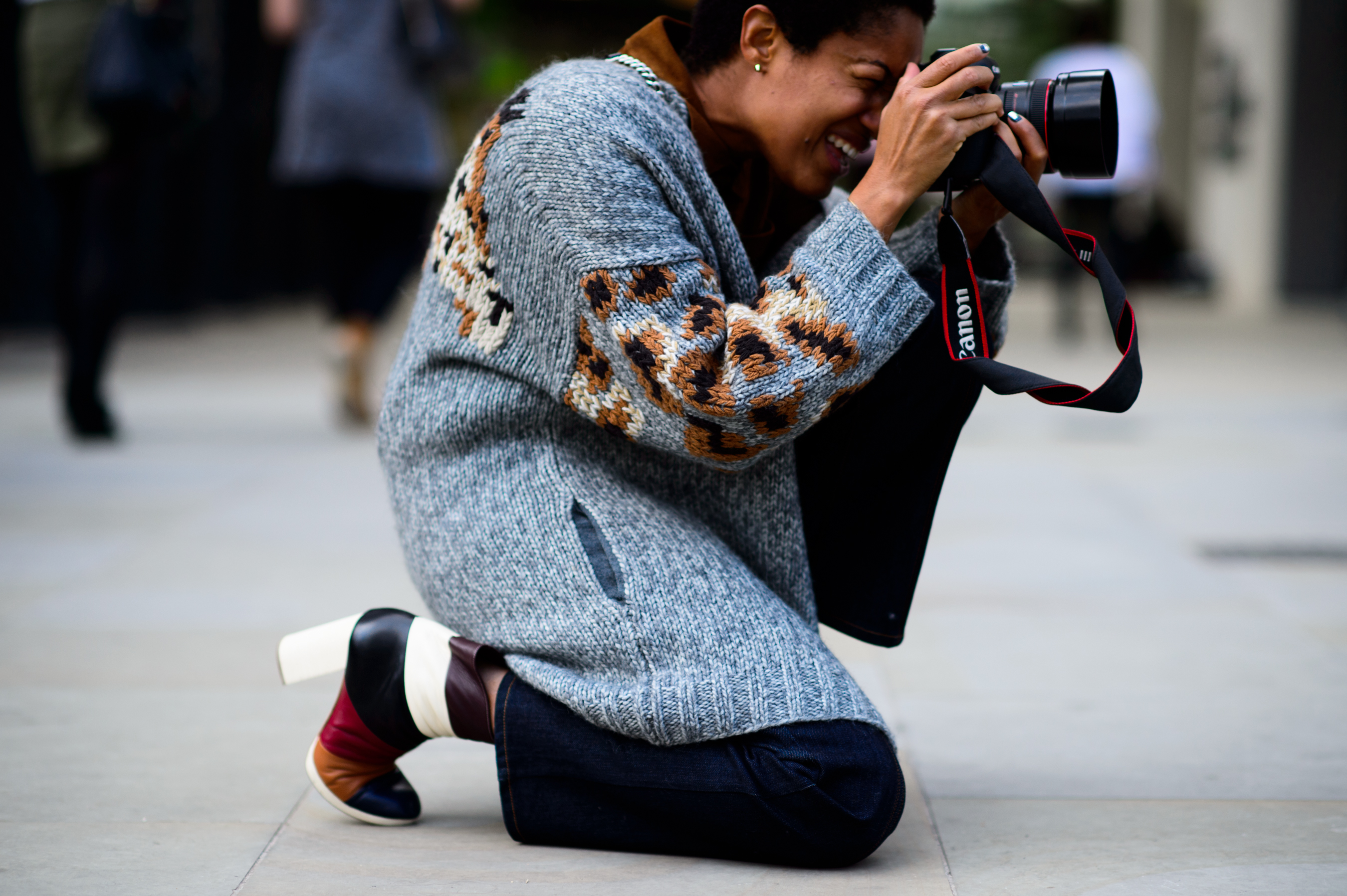 Photographer on her knee shooting