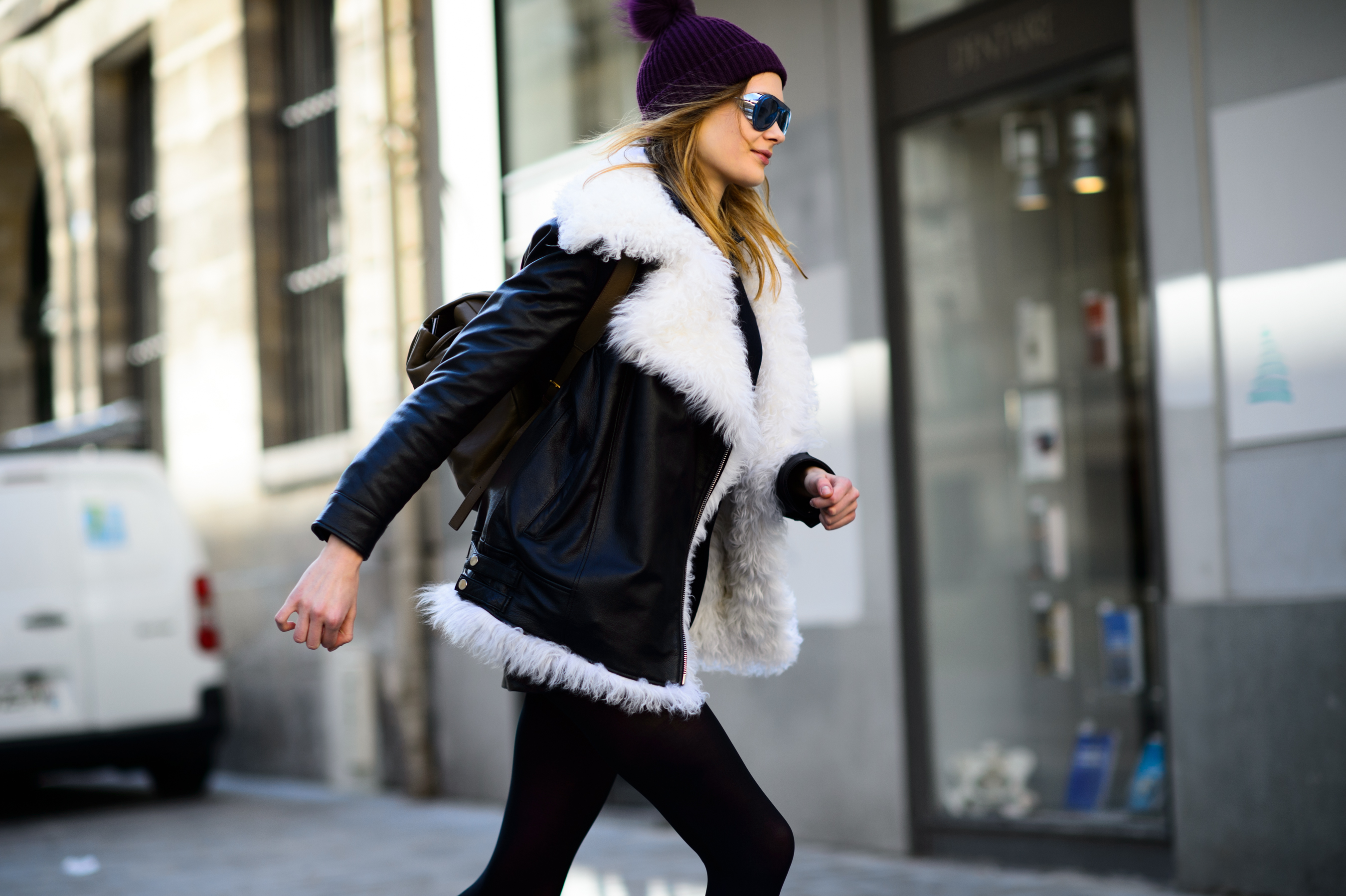 Model wearing furry jacket and glasses