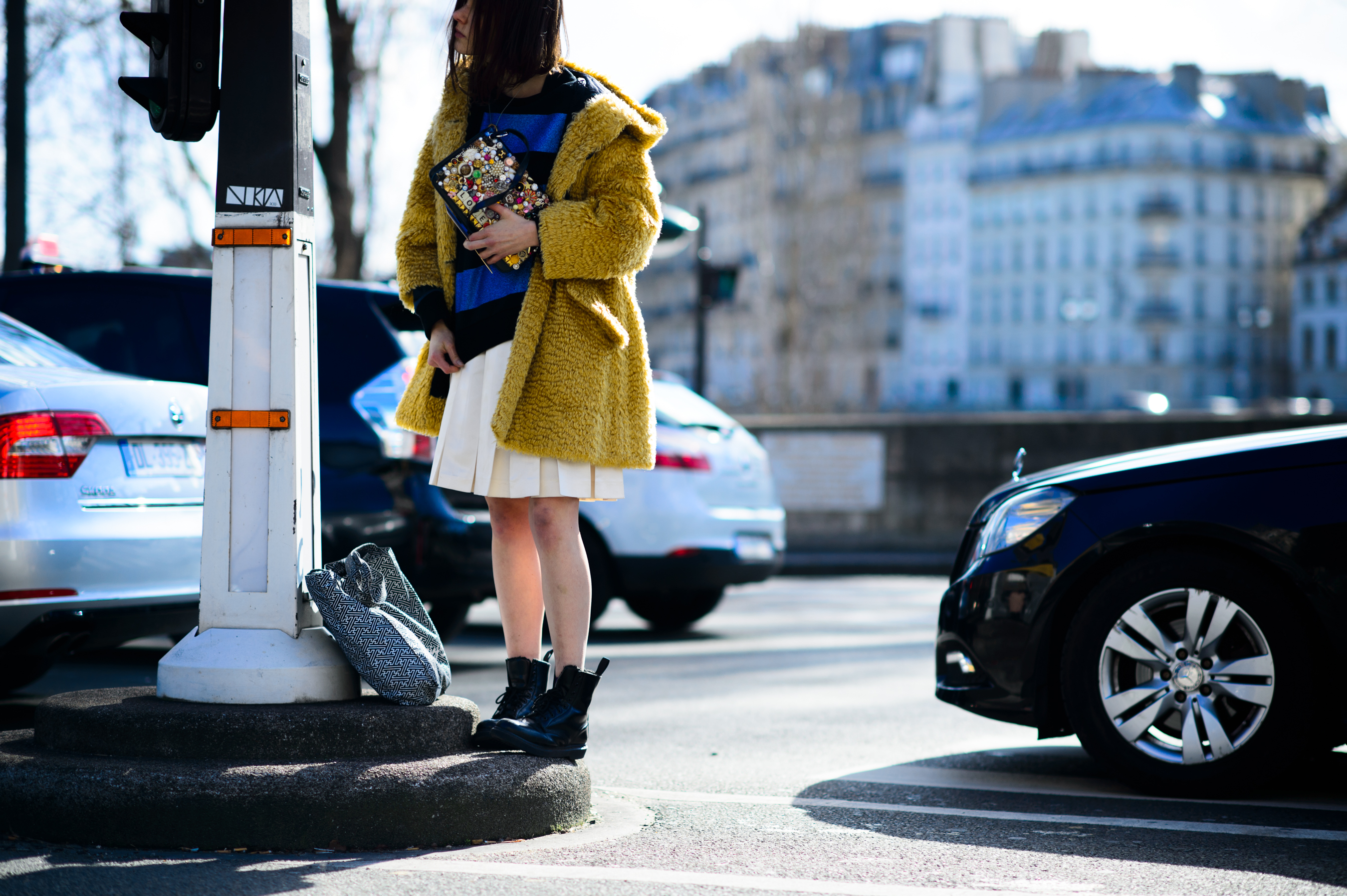 Garage magazine editor wearing yellow coat