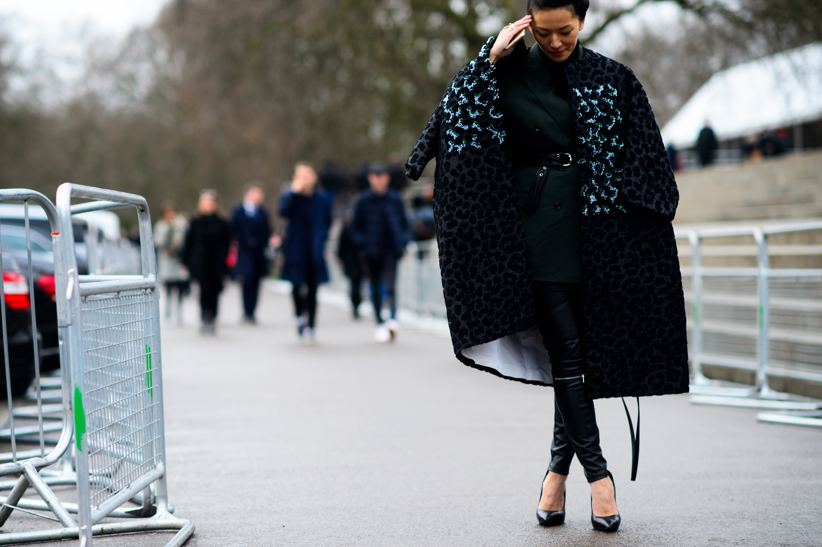 Asian woman wearing coat after Burberry show