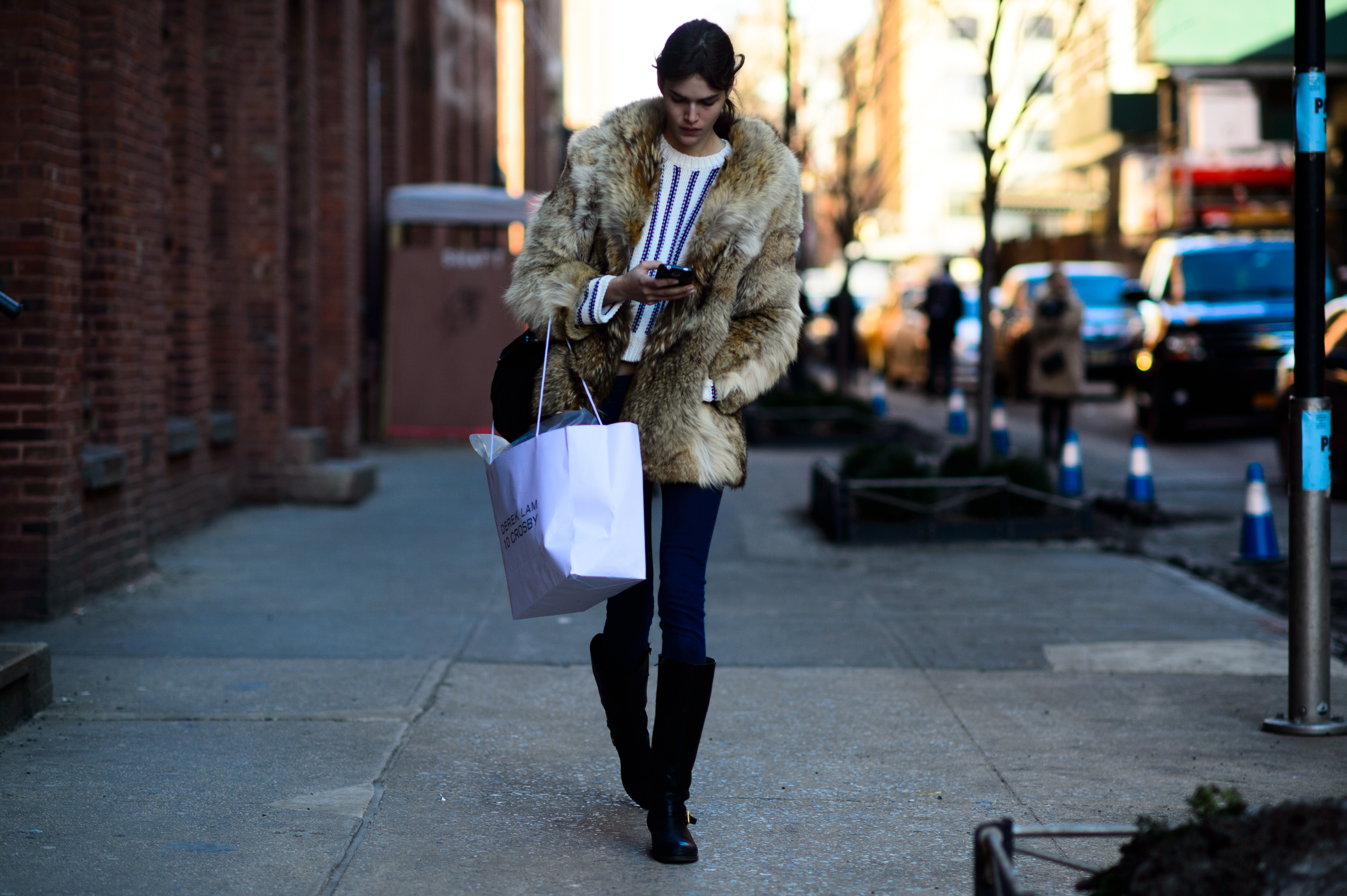 Model wearing fur coat after the show