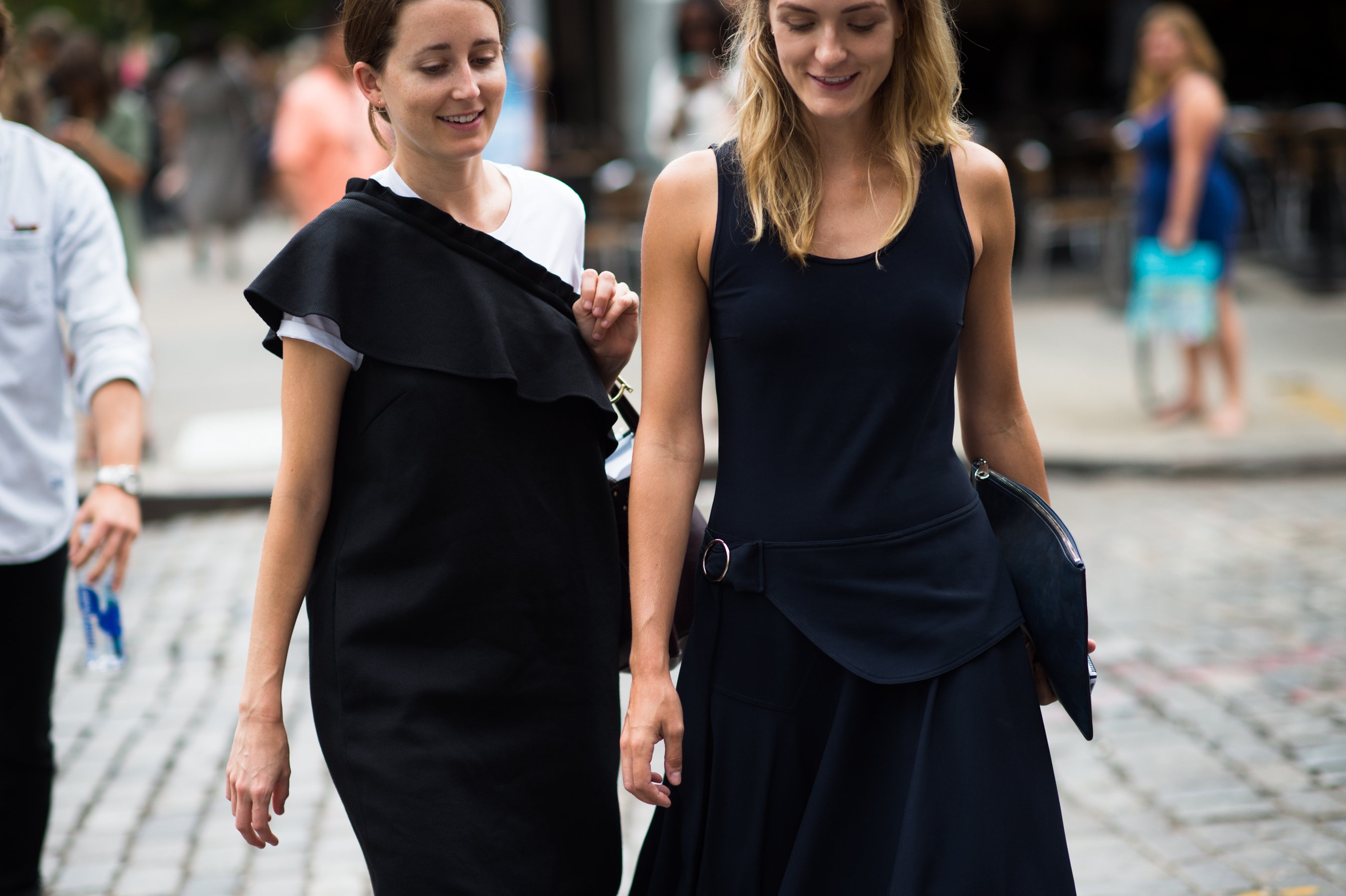 Two women dressed in black walking together