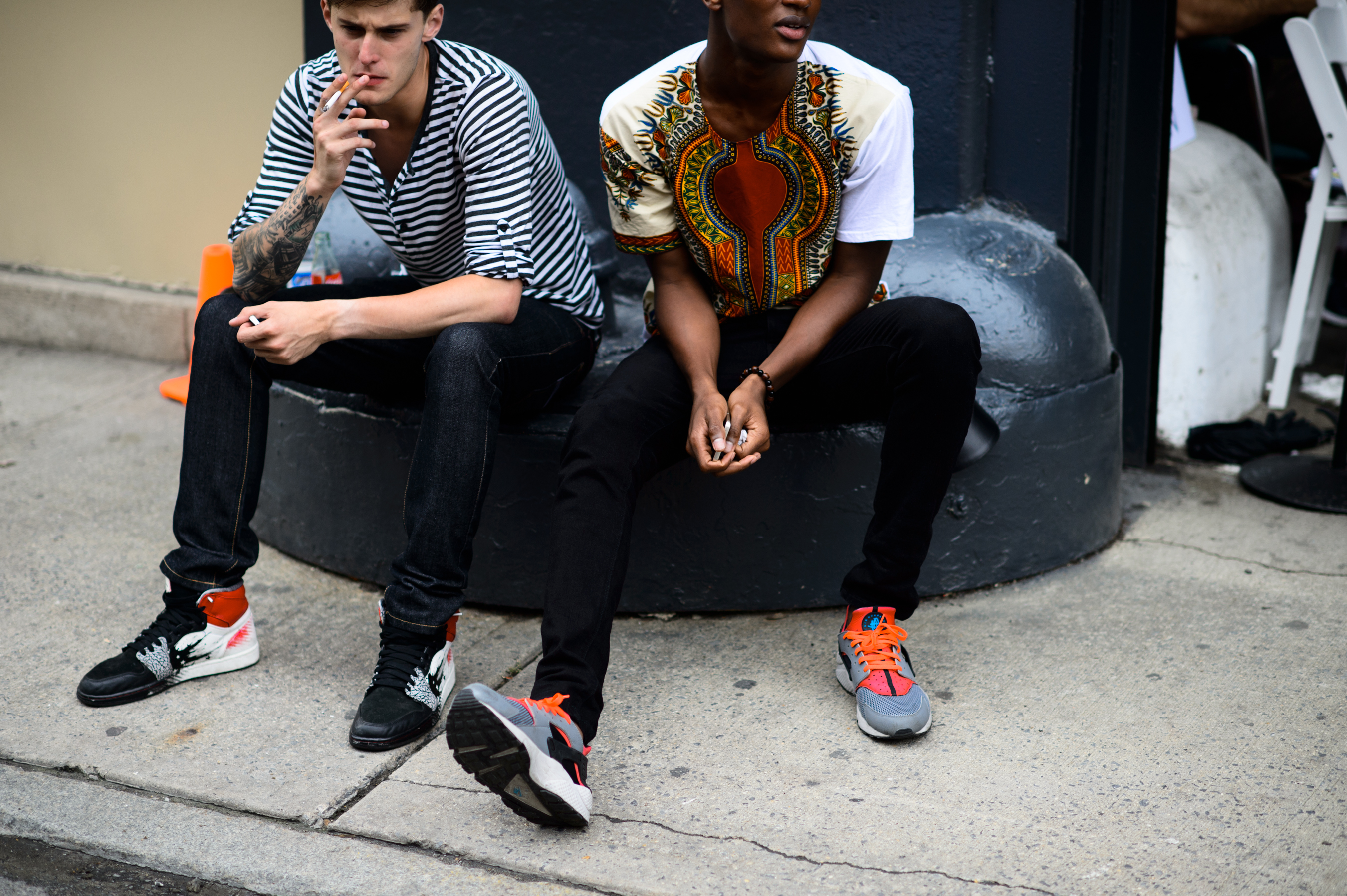 Two male model wearing colourful sneakers