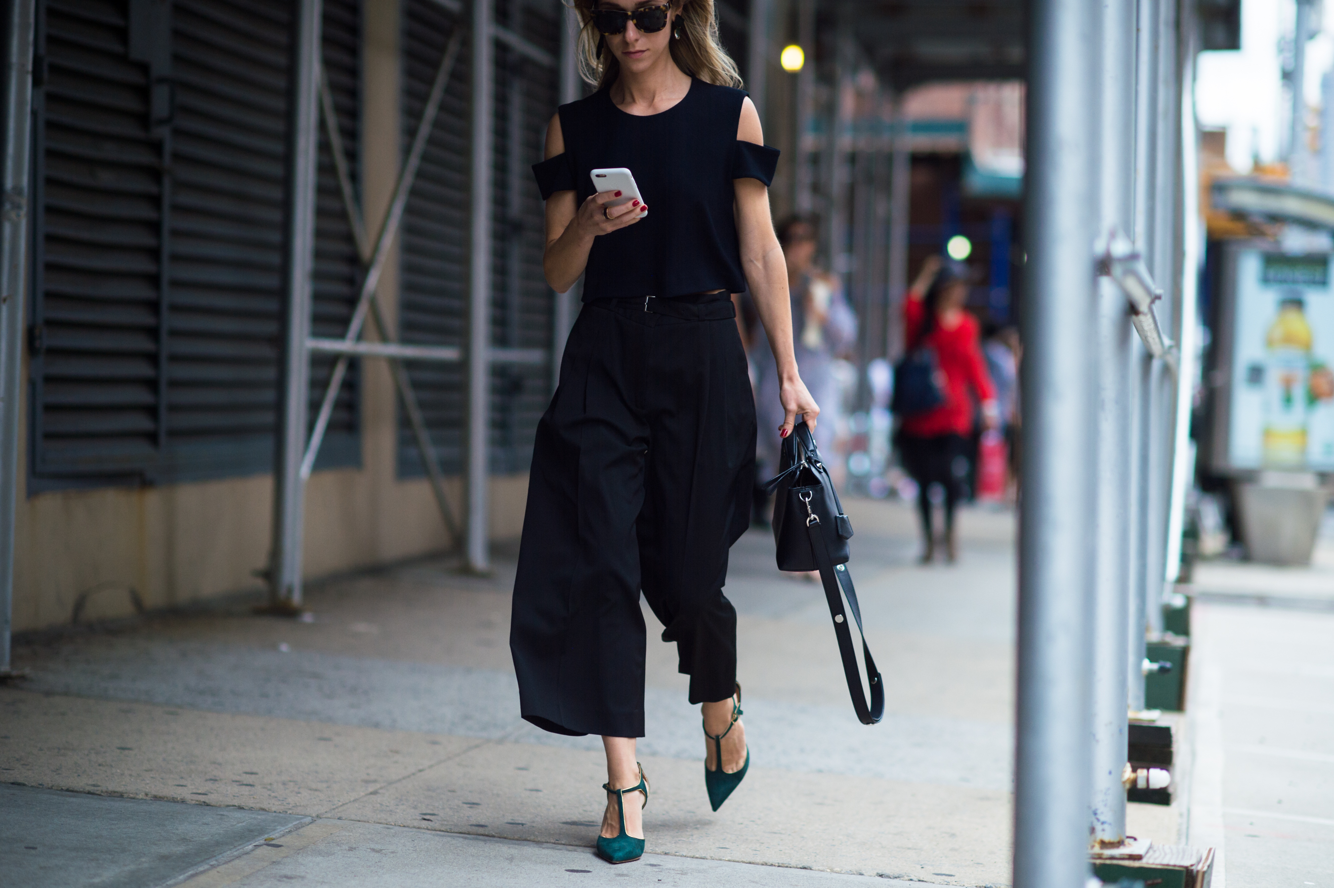 Woman wearing black outfit and shoes