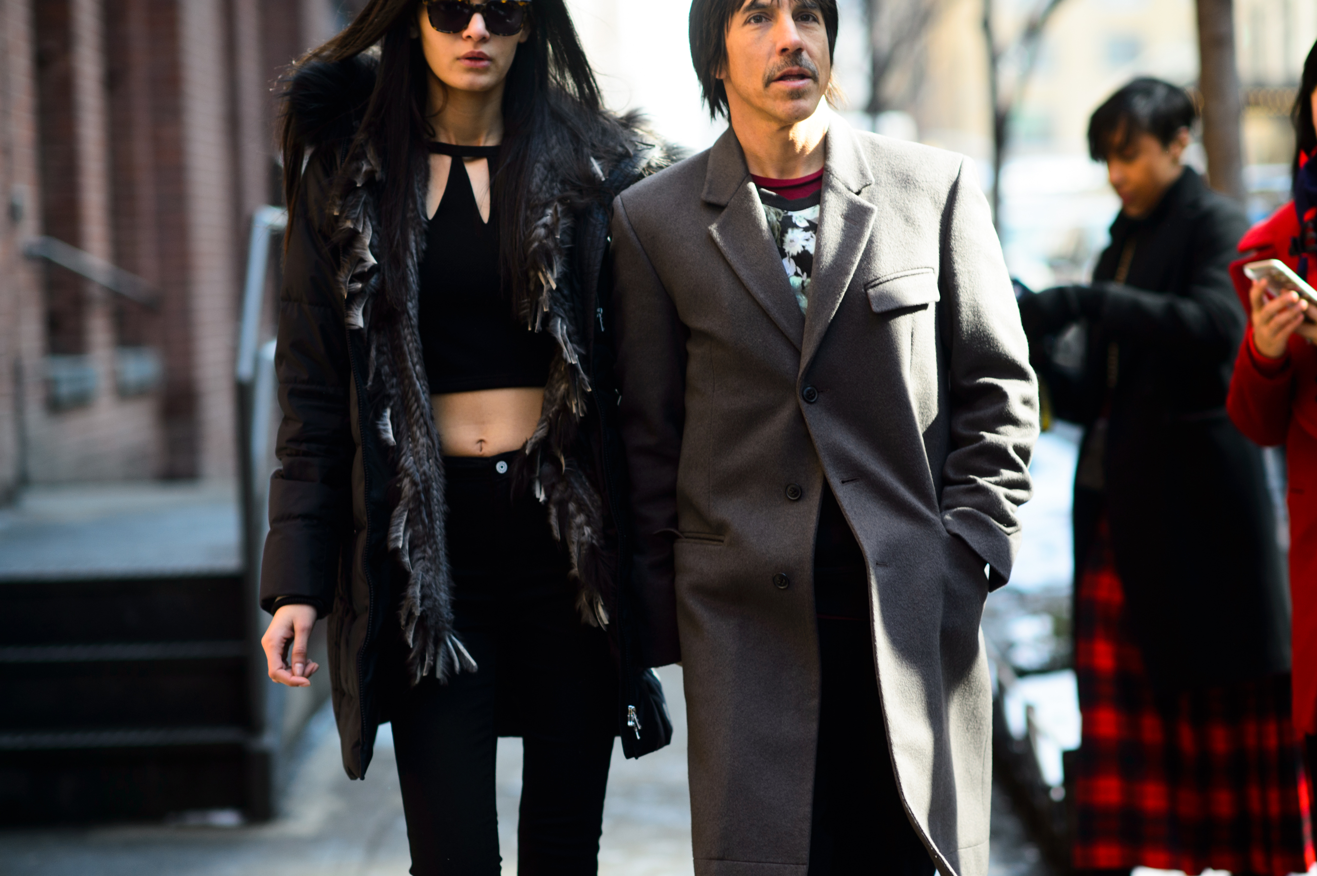 Red Hot Chilli Peppers lead vocalist with a woman