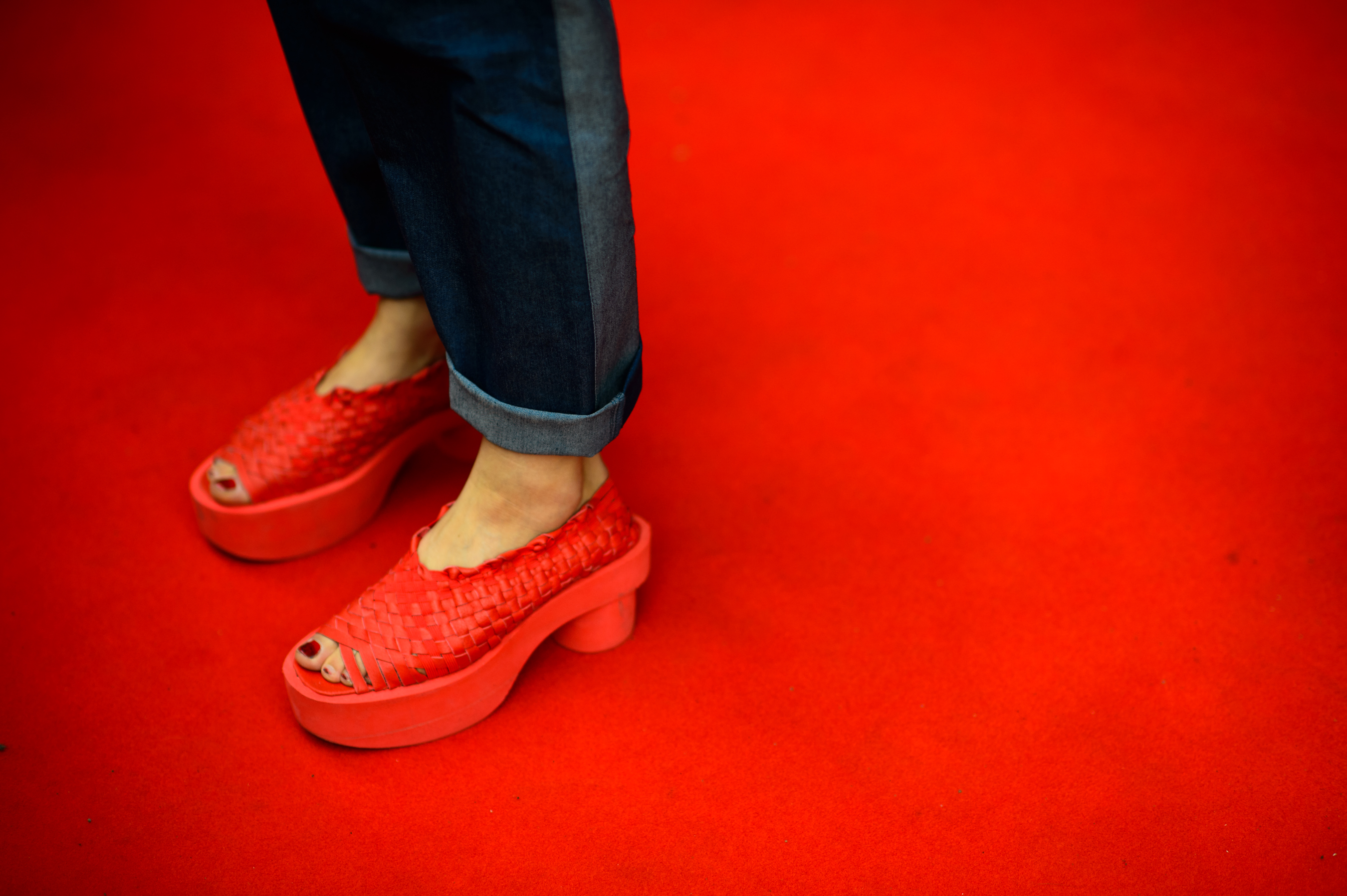 Red shoes on a red carpet