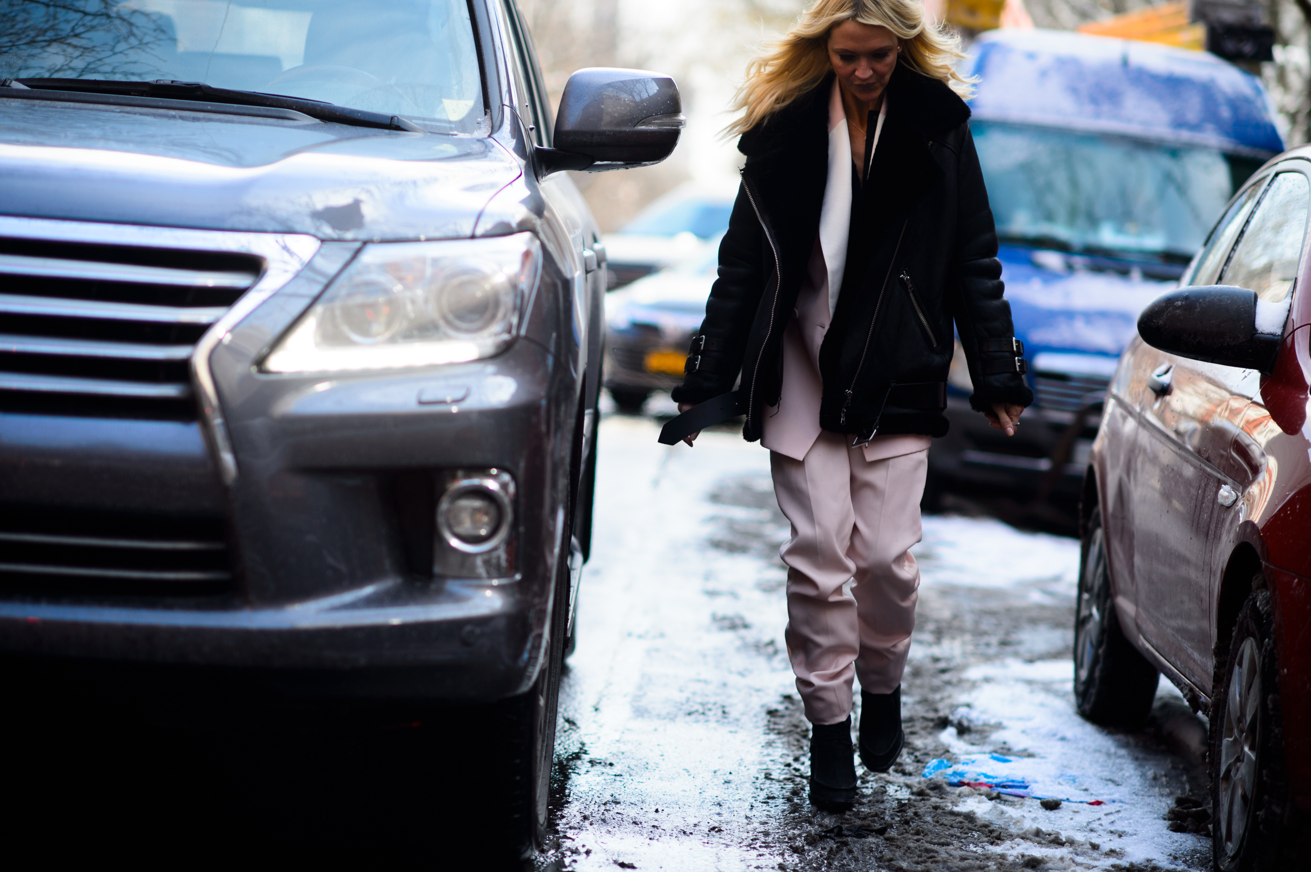 Woman wearing pink suit after and sheering jacket