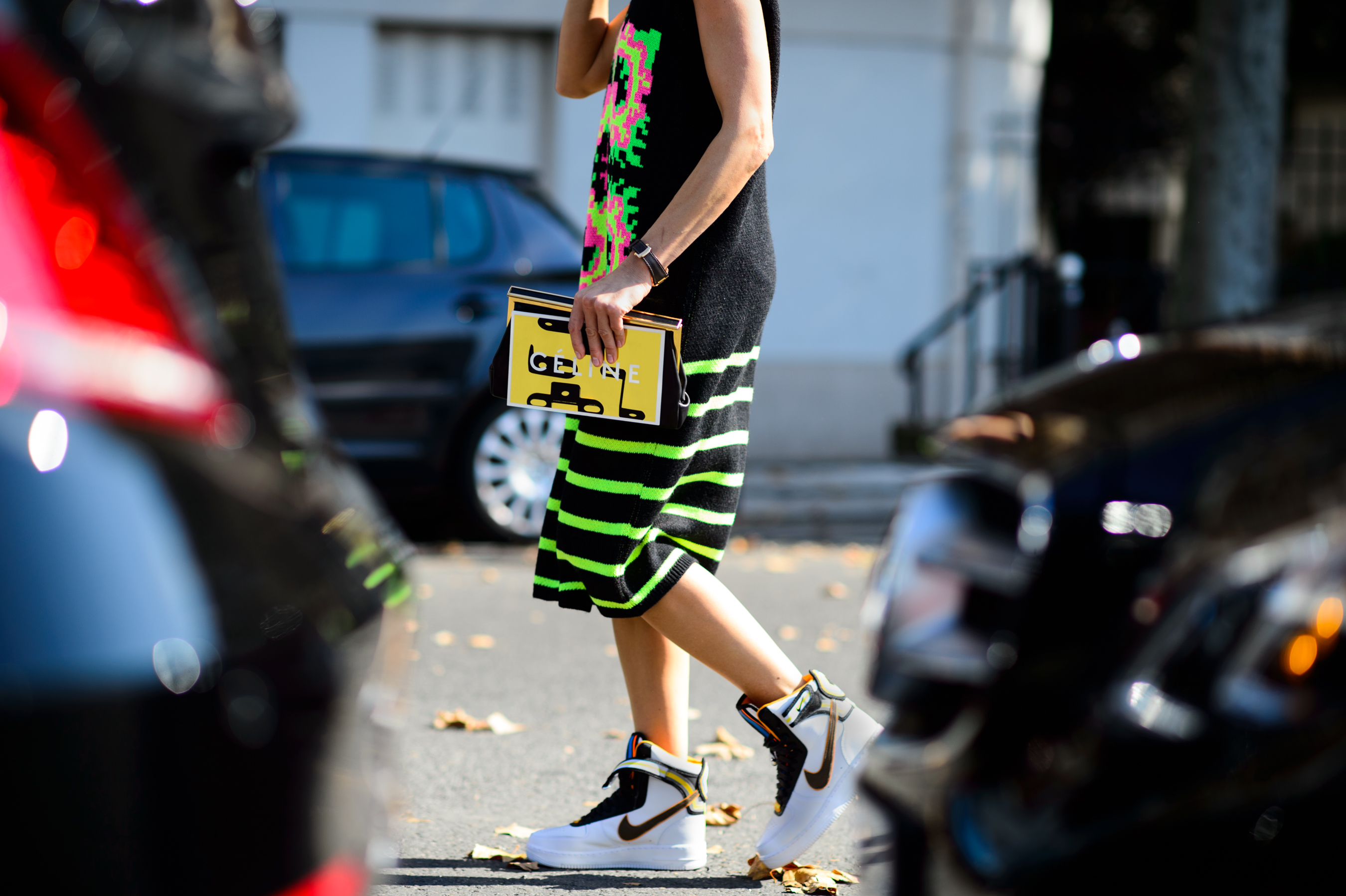 Woman wearing neon stripes knit dress
