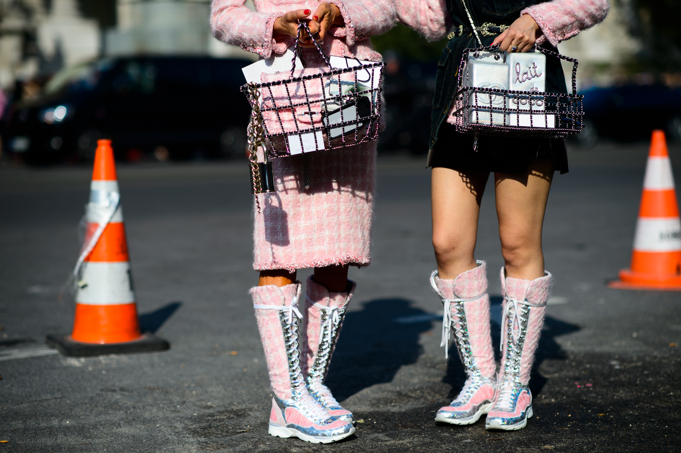 Two women wearing pink Chanel outfits