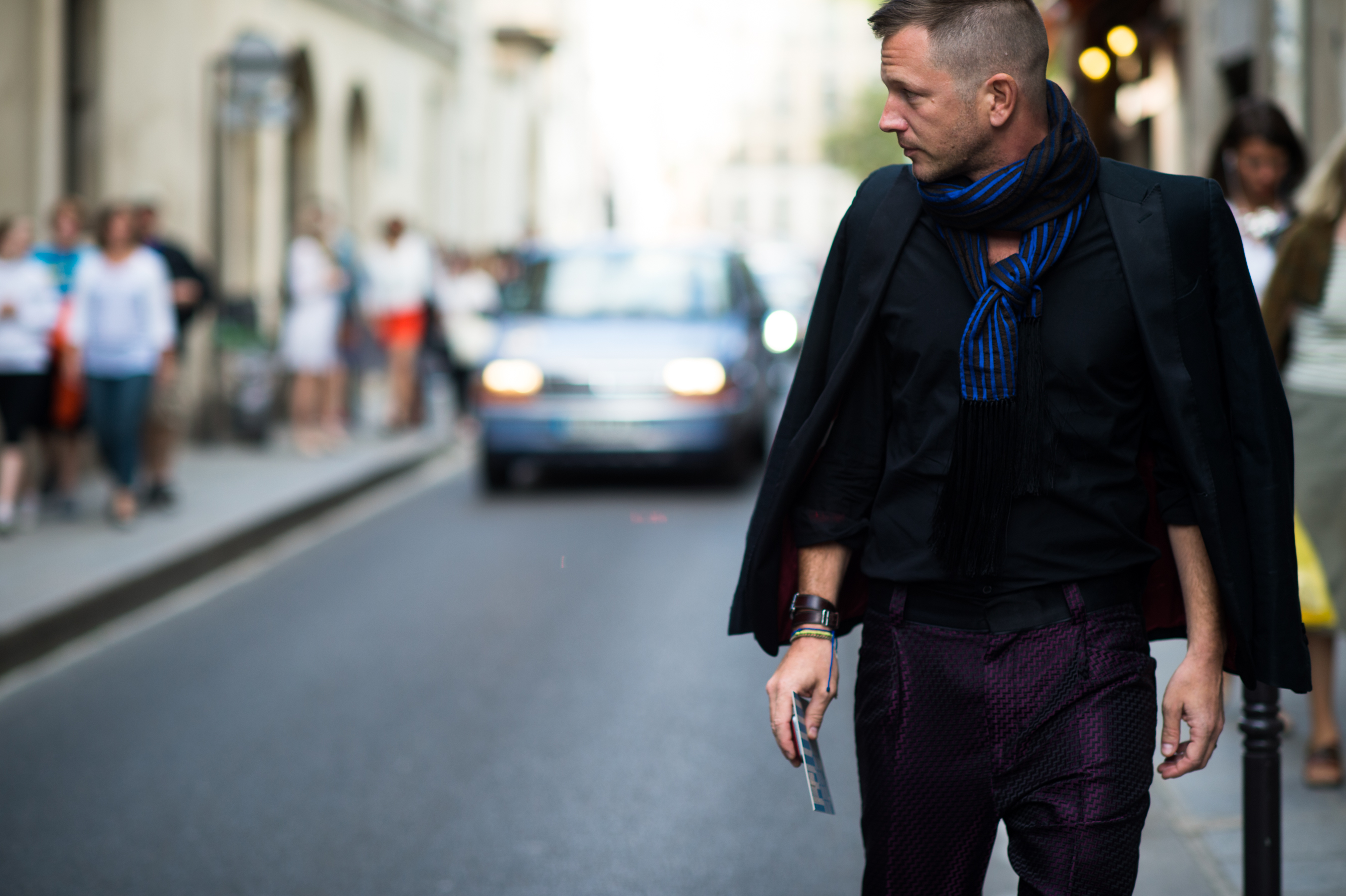 Man wearing scarf and silk pants