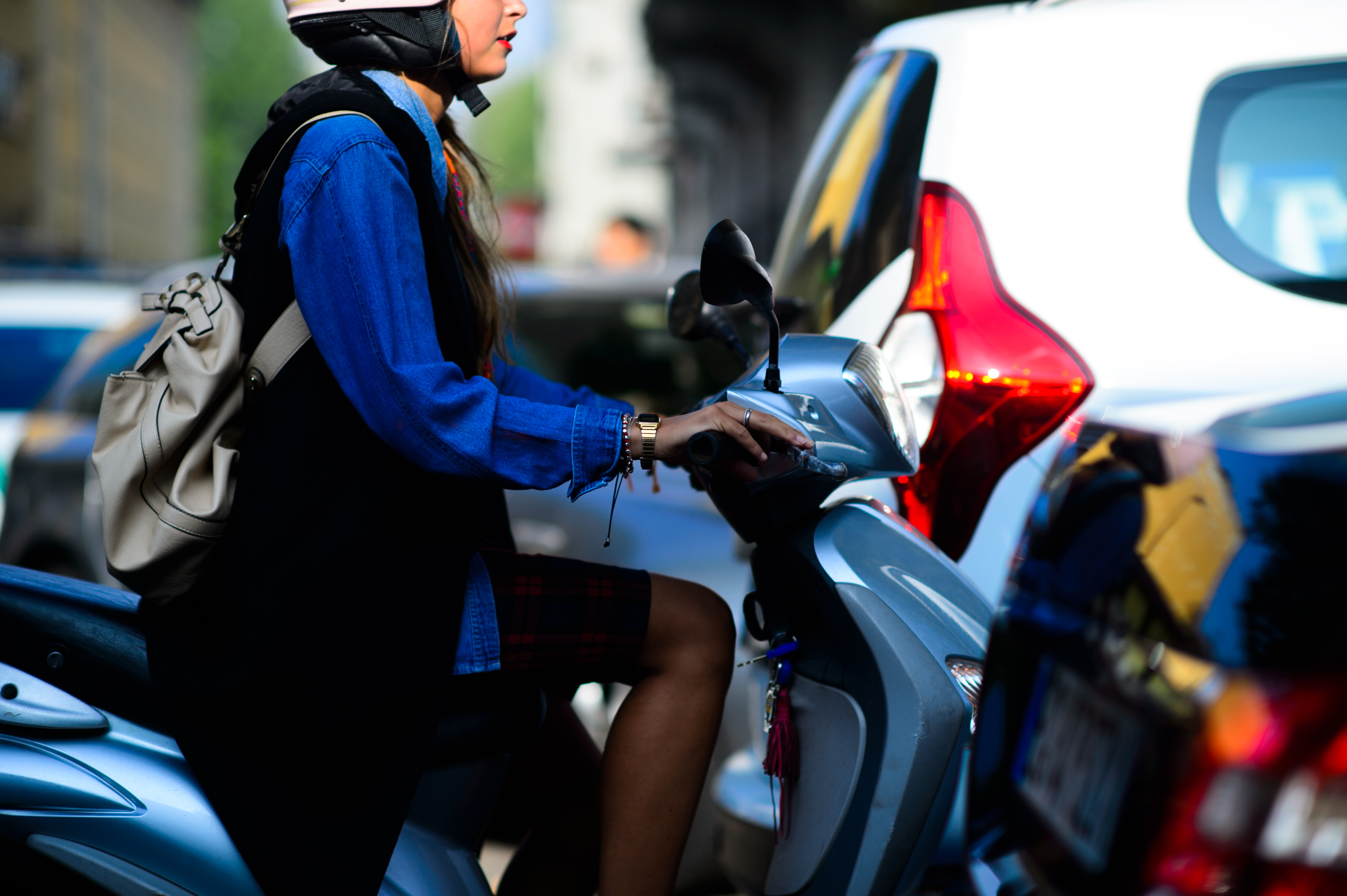 Model riding a scooter after the show