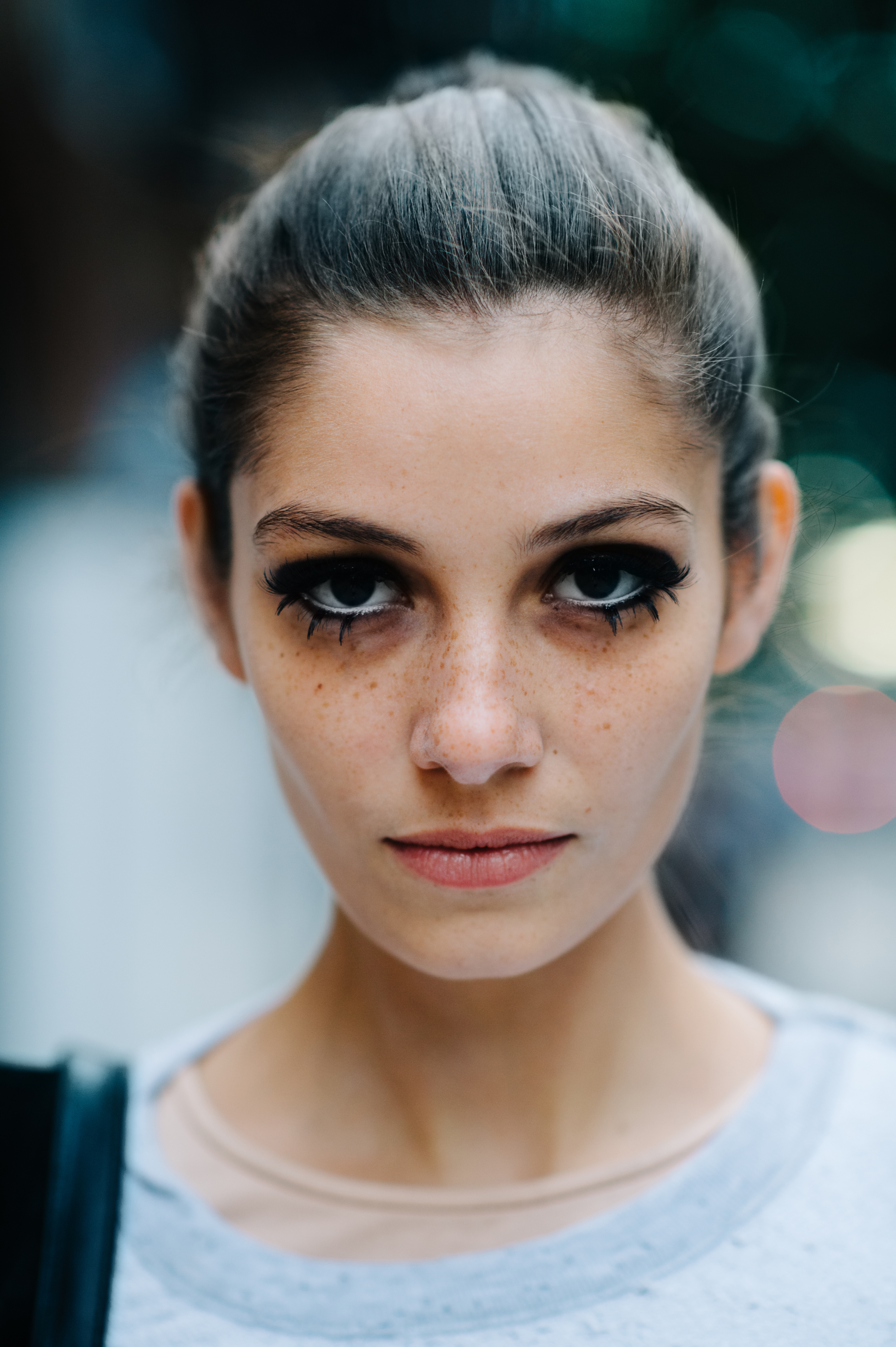 Portrait of a model with big eyelashes after the show