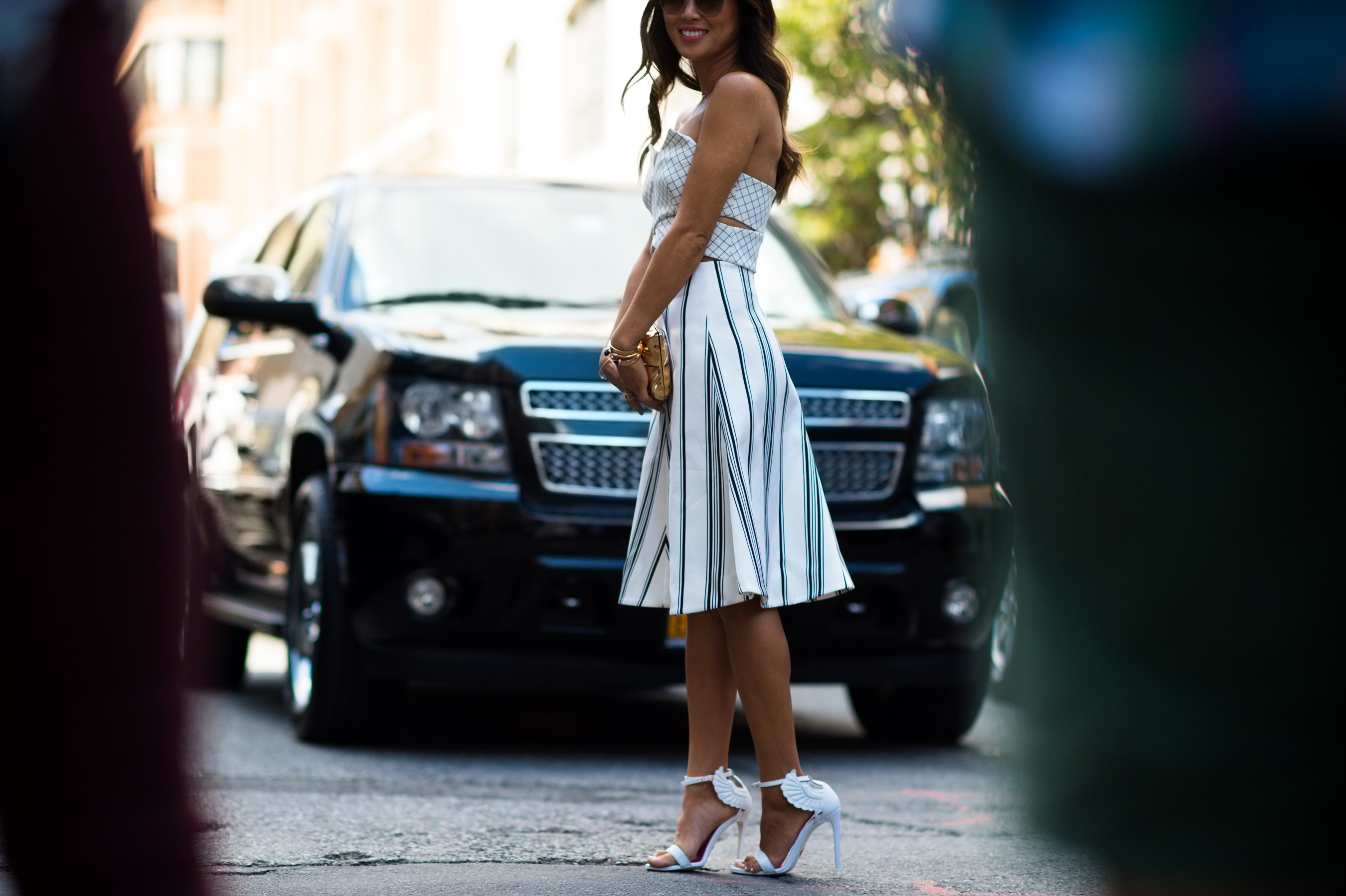 Blogger wearing white dress and sandals