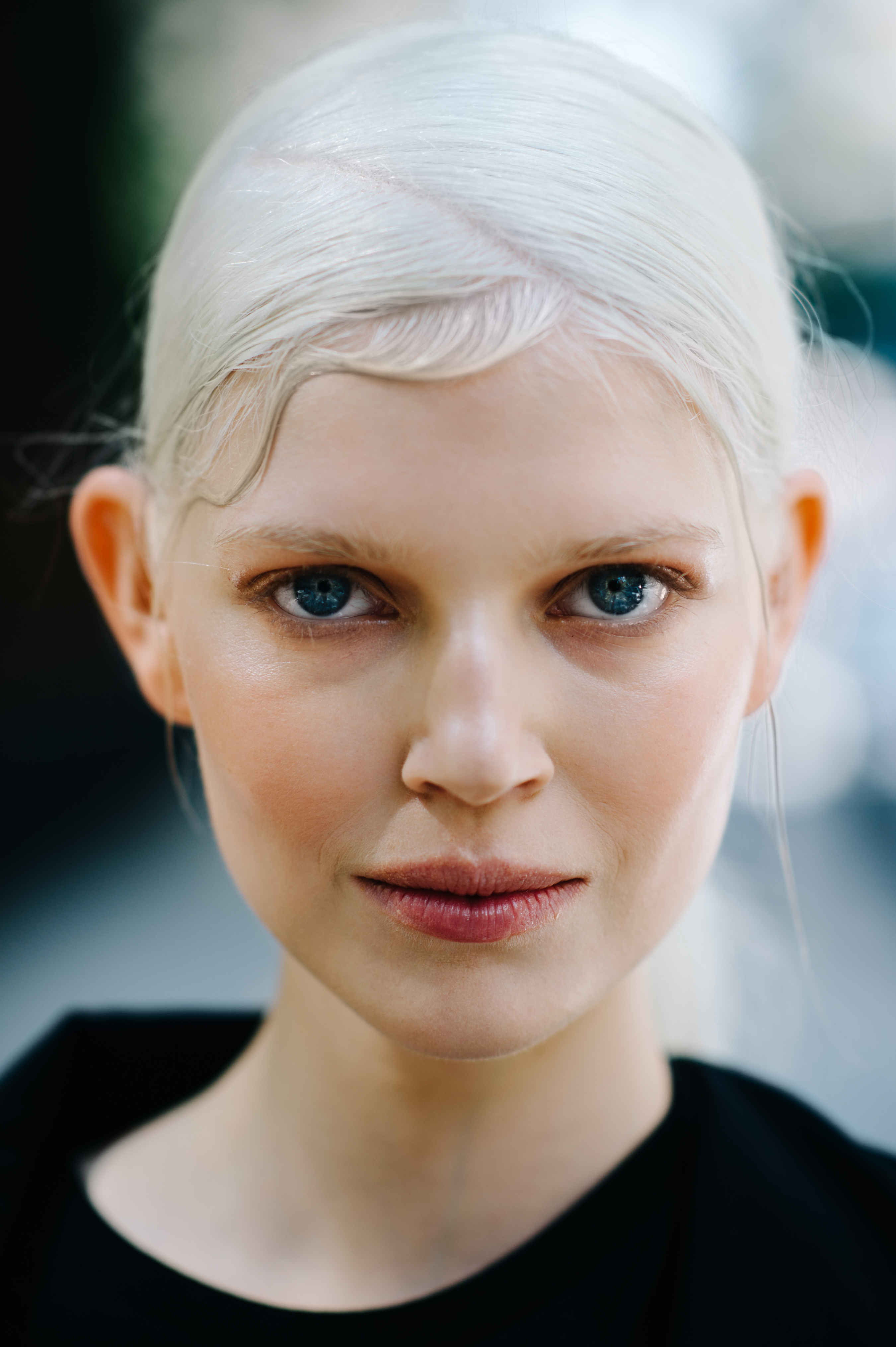 Portrait of Polish model with big blue eyes and white hair