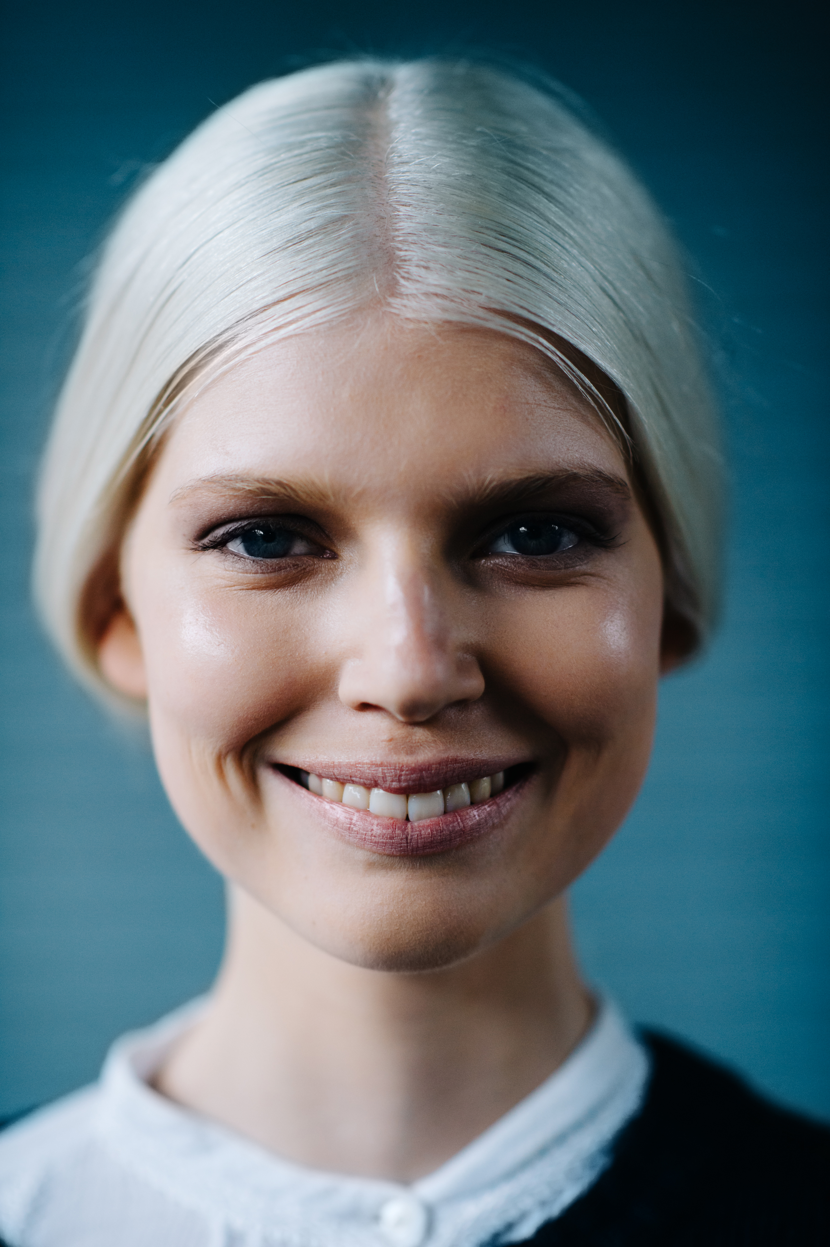 Portrait of a smiling Polish model with white hair