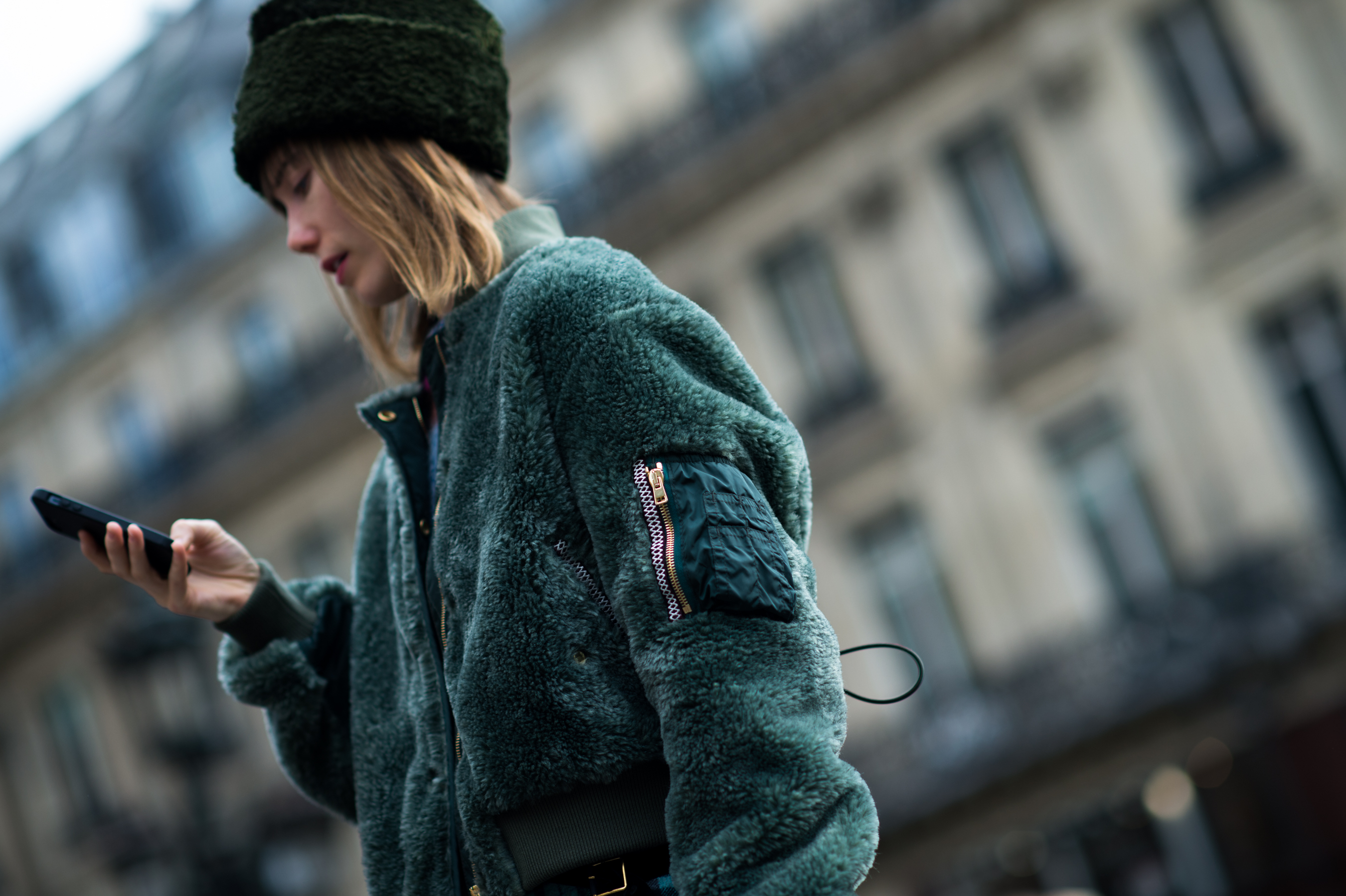 Russian woman wearing green plush jacket
