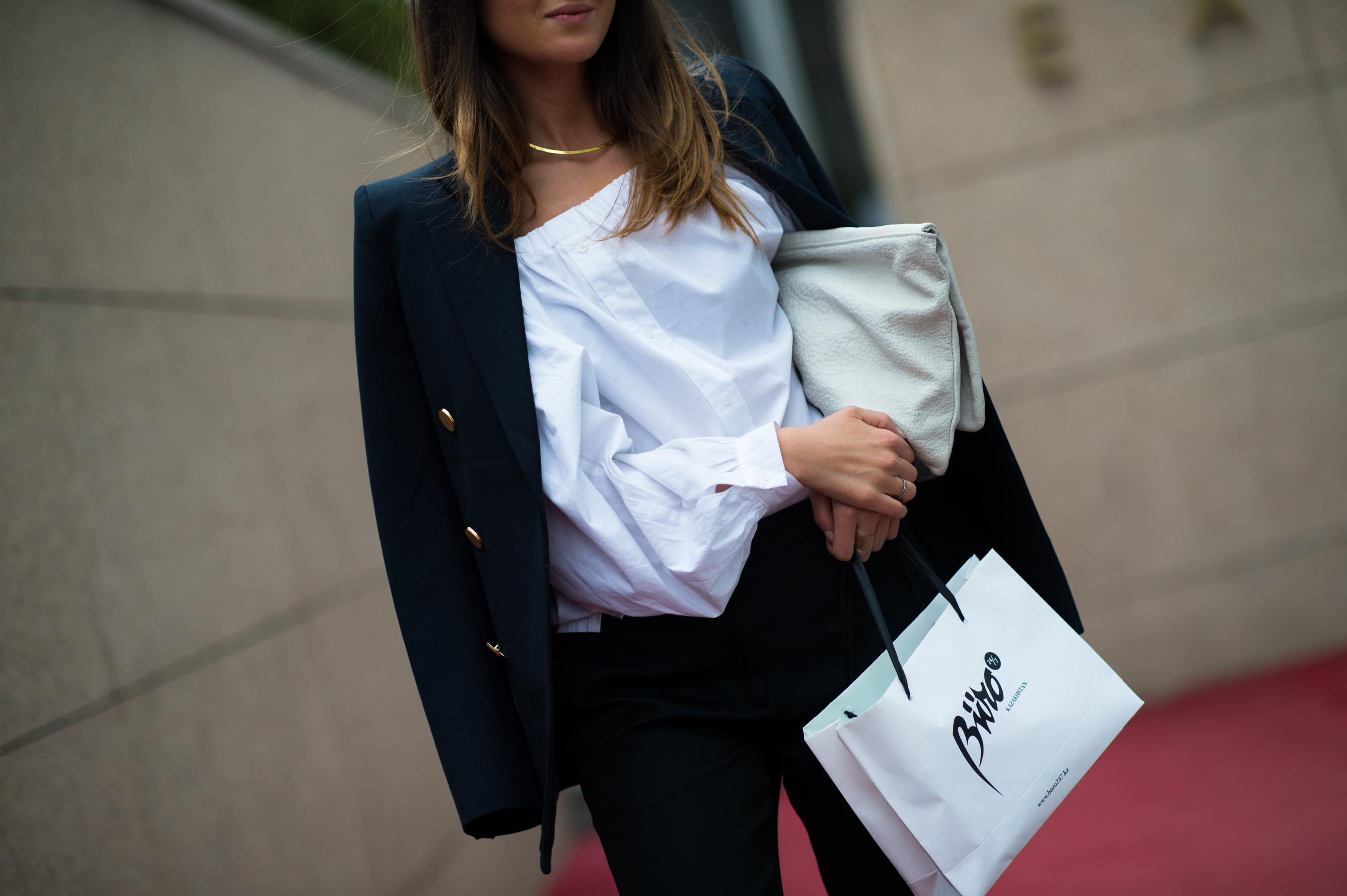Woman wearing white shirt and black jacket