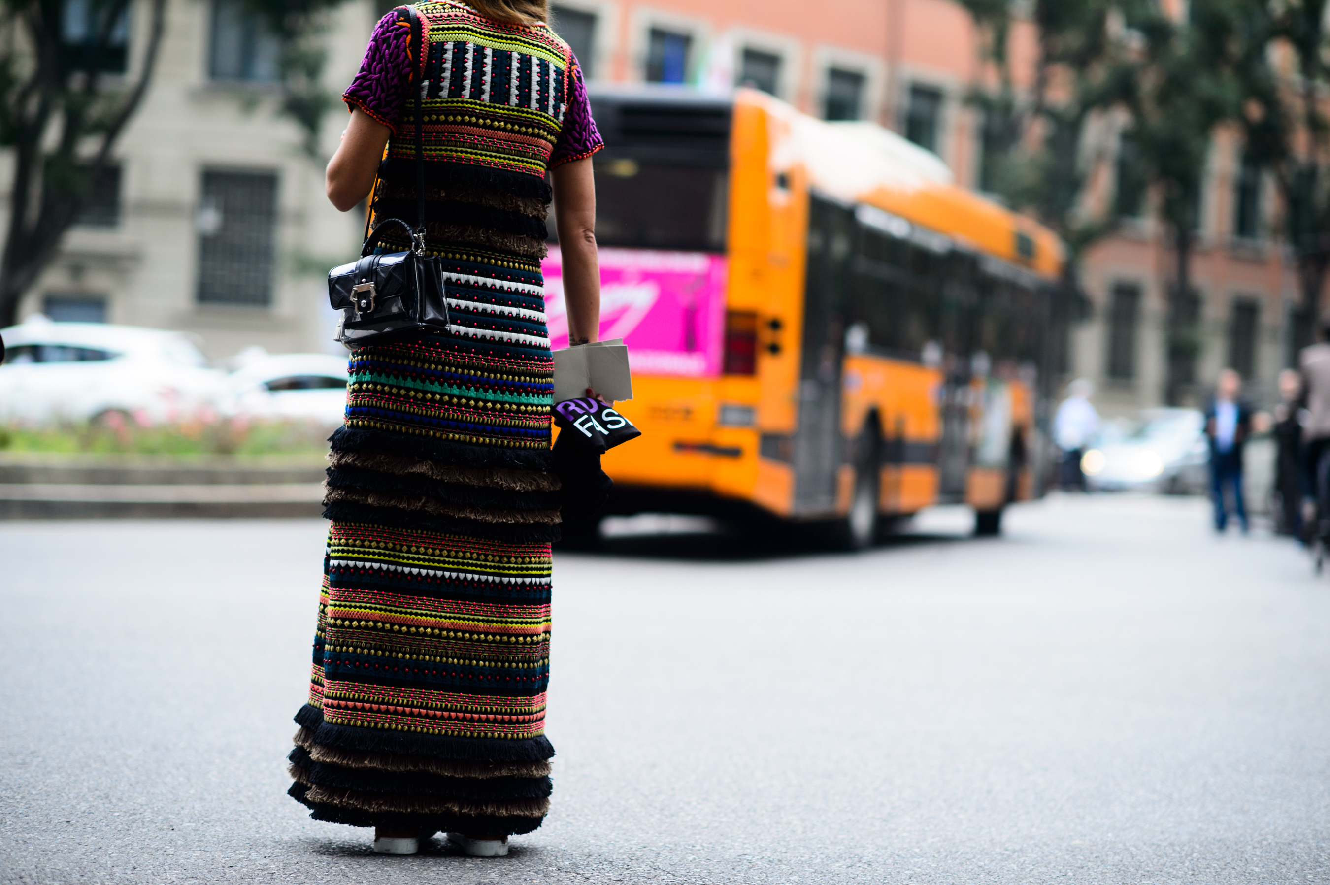 Woman wearing complex print dress after Armani show