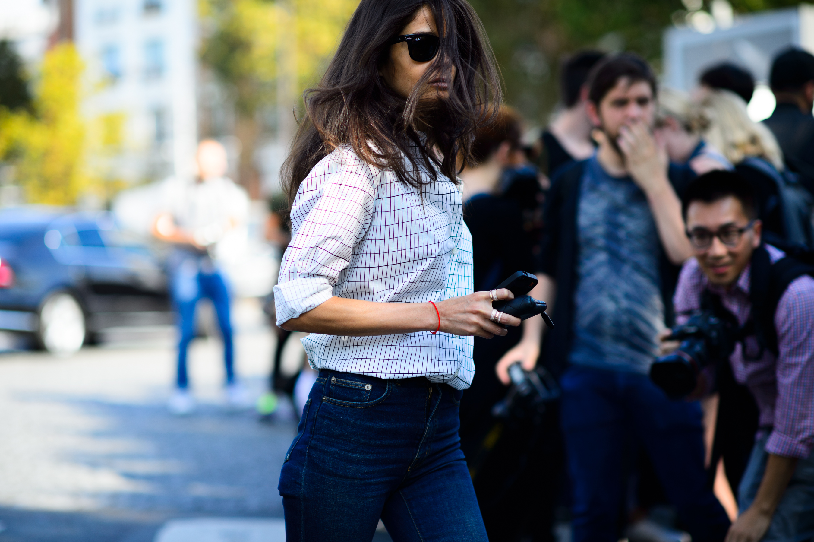 Woman with shirt tucked into jeans