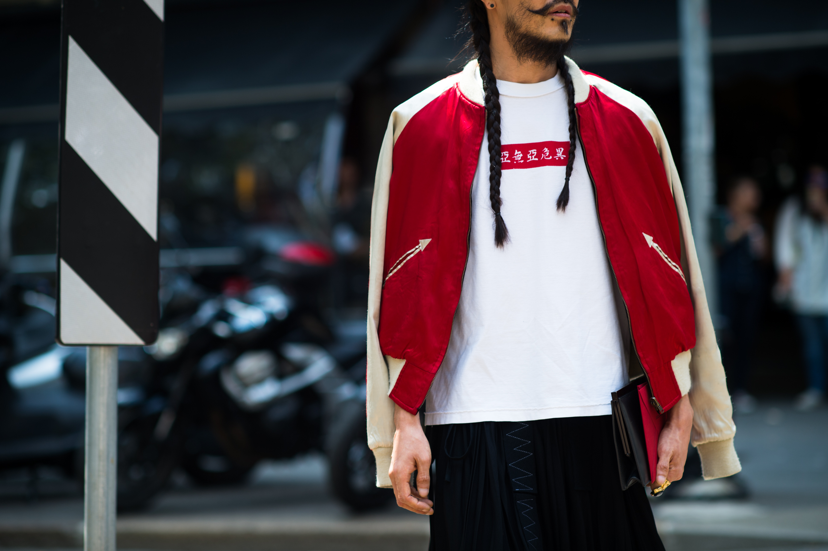 Man wearing red bomber jacket